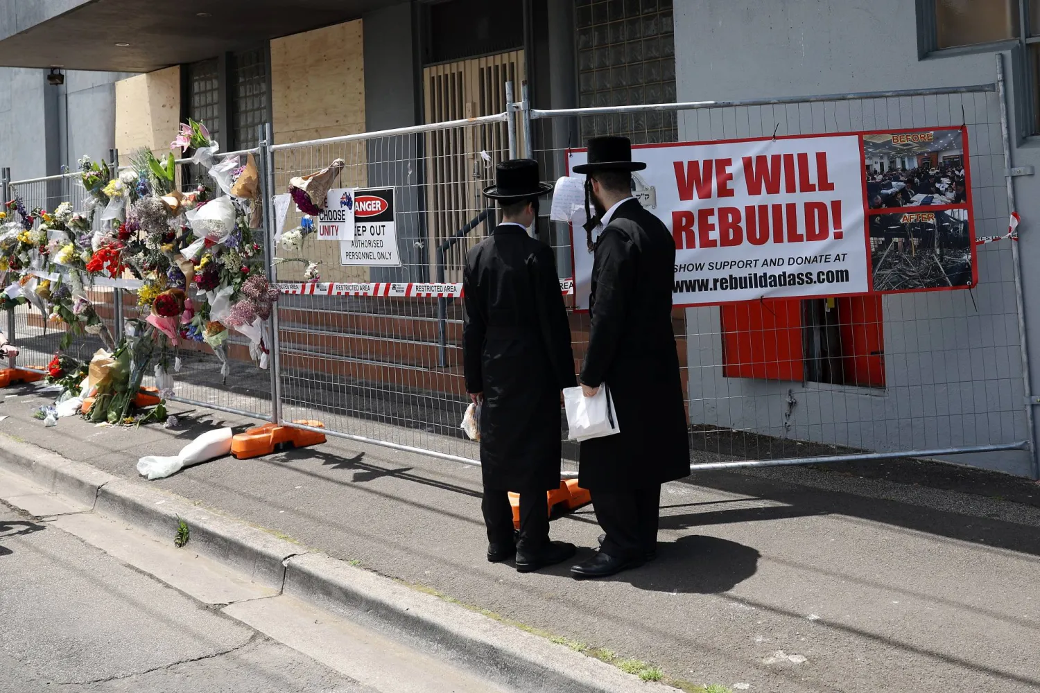 People gather outside the Adass Israel Synagogue, Dec. 9, 2024, after a firebombing in Melbourne, Australia. (Con Chronis/AAP Image via AP)