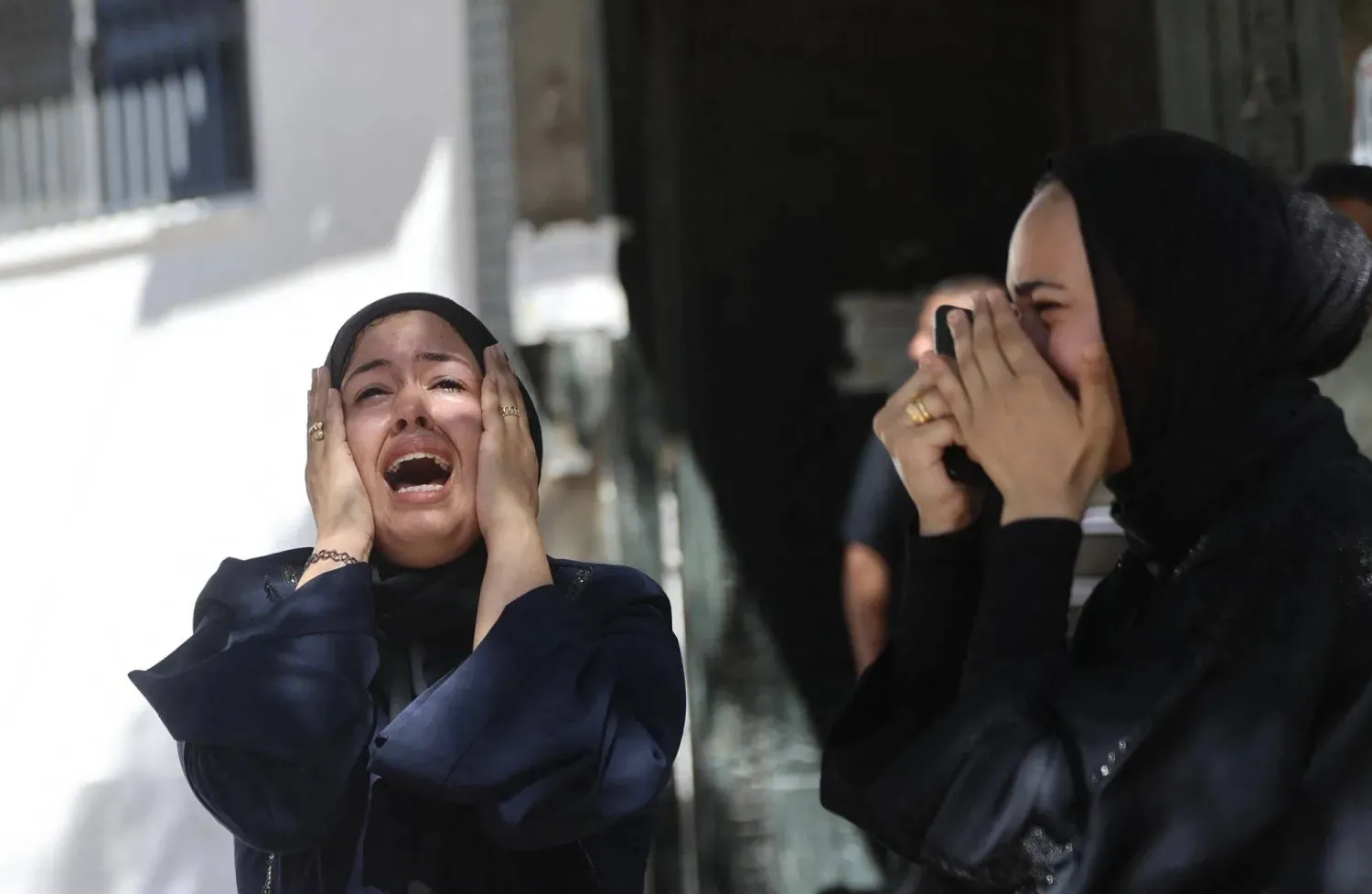 Palestinian women mourn during the funeral of a man killed in an Israeli strike in Gaza City on Thursday. (AFP)