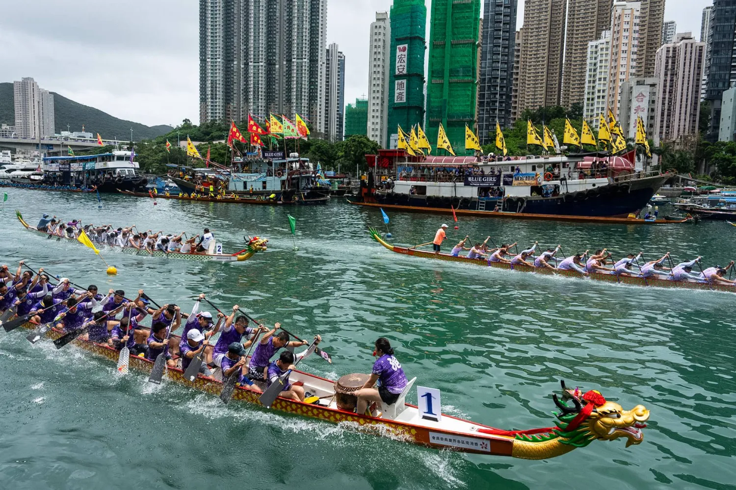 Competitors take part in the Aberdeen Dragon Boat Race to celebrate the Dragon Boat Festival in Hong Kong, Friday, June 19, 2026. (AP Photo/Chan Long Hei)