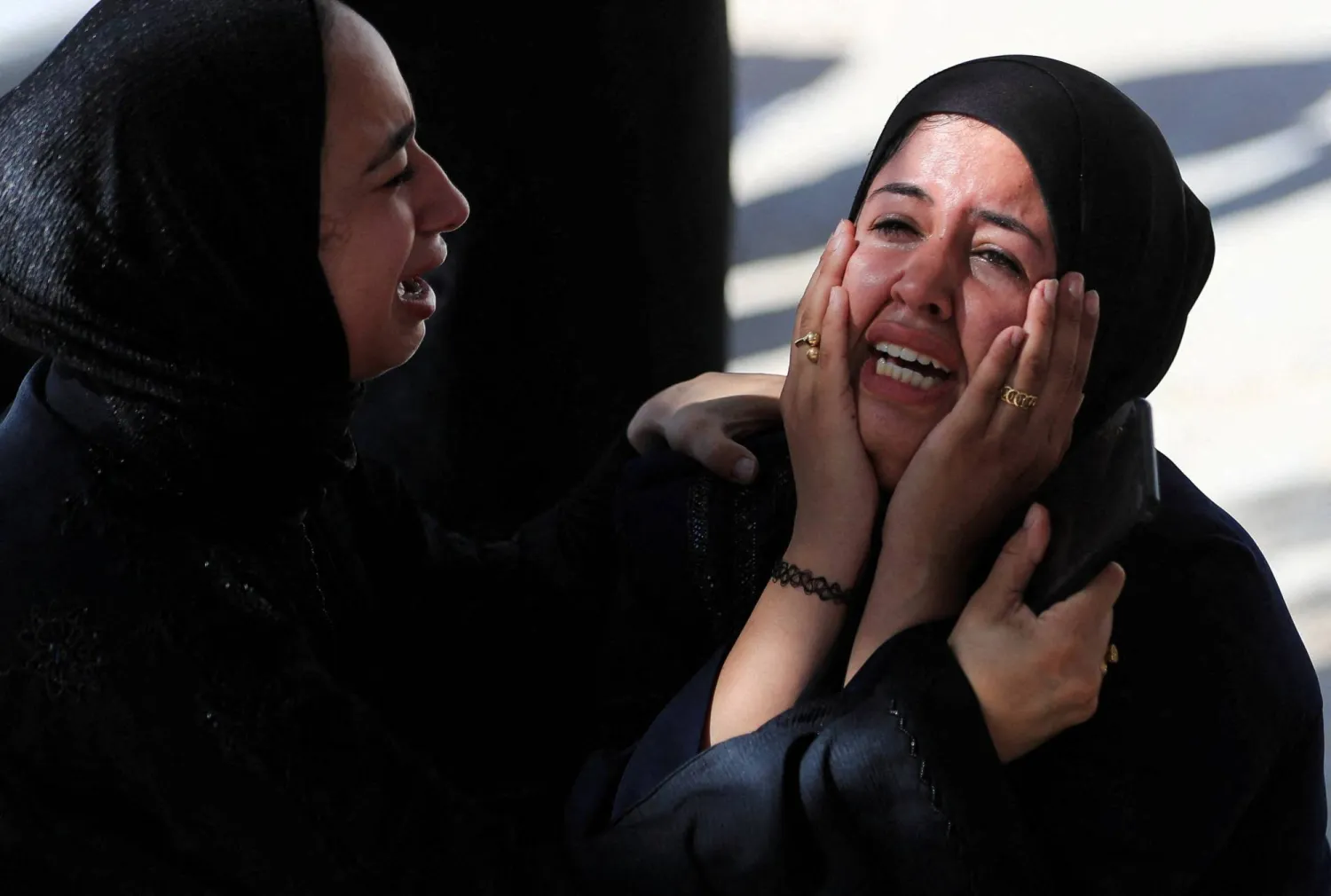 Mourners react during the funeral of Palestinians killed in an Israeli strike on a vehicle, according to medics, in Gaza City, June 18, 2026. REUTERS/Dawoud Abu Alkas    