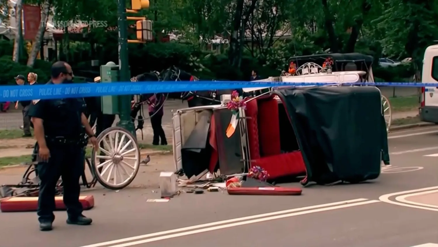 Police investigate the scene after a Central Park carriage horse bolted away from its driver killing a teenager from India on Wednesday, June 17, 2026 in New York. (WABC-TV via AP)