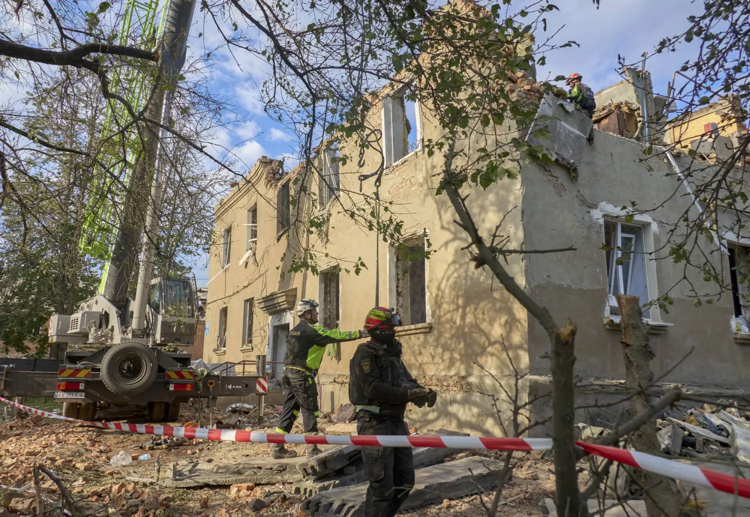 Ukrainian rescuers work at the site of a Russian glide bomb strike on a residential building in Kharkiv, Ukraine, 20 June 2026, amid the ongoing Russian invasion. EPA/SERGEY KOZLOV