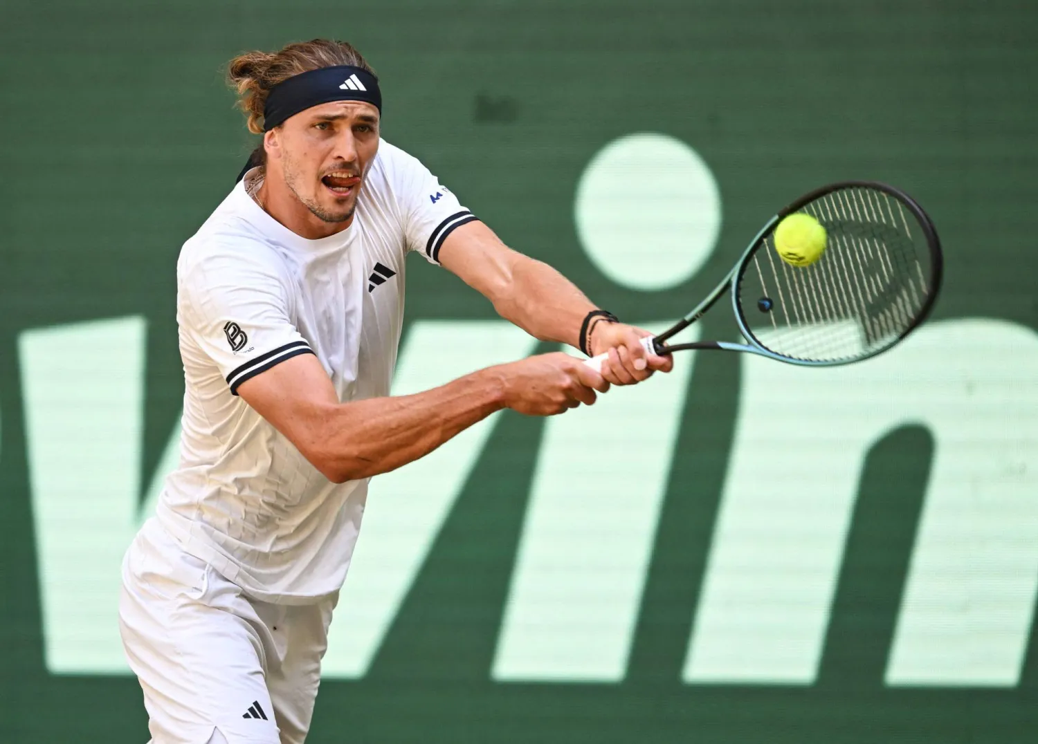 Germany's Alexander Zverev returns the ball to Taylor Fritz of the US during their men's singles semi-final match of the Halle Open ATP tennis tournament in Halle, western Germany, on June 20, 2026. (Photo by CARMEN JASPERSEN / AFP)
