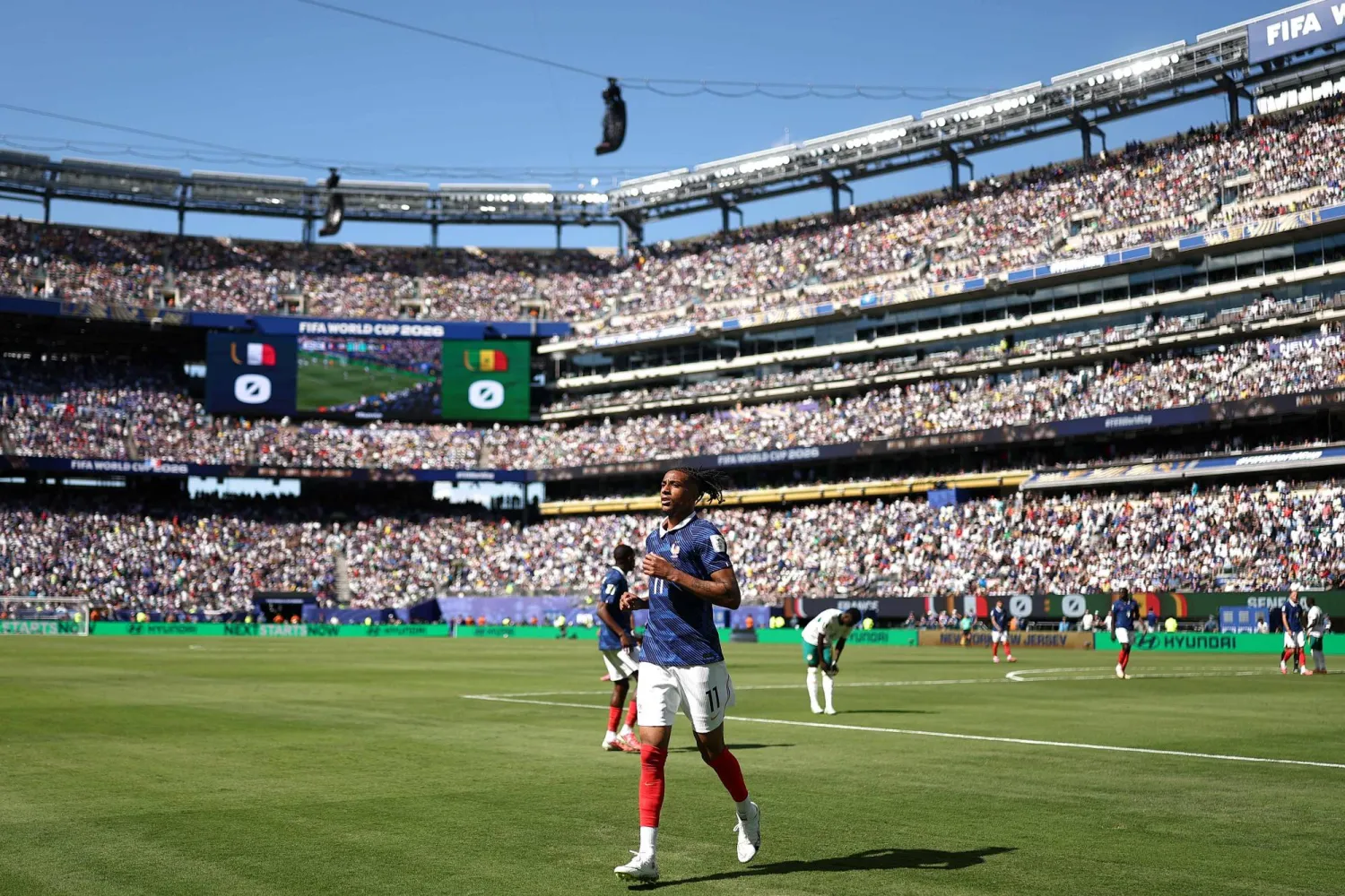 France's forward #11 Michael Olise prepares to take a corner during the 2026 World Cup Group I football match between France and Senegal at the New York/New Jersey Stadium in East Rutherford on June 16, 2026.  (Photo by CHARLY TRIBALLEAU / AFP)