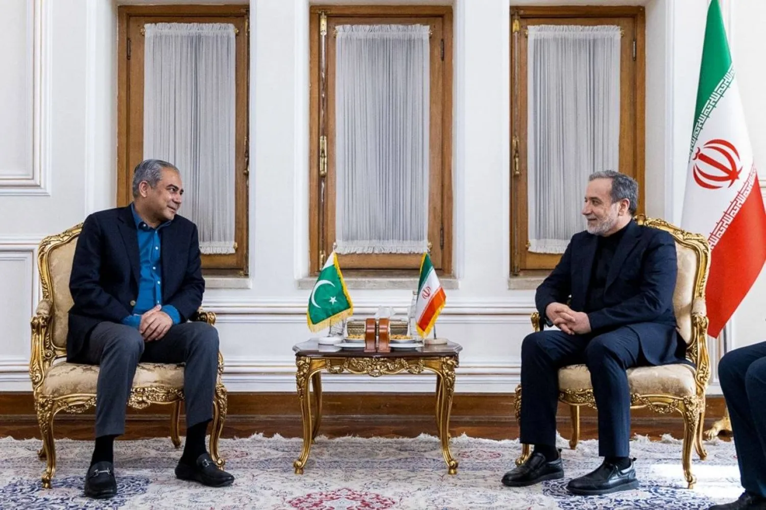 In this photo, released by the Iranian Foreign Ministry, Foreign Minister Abbas Araghchi, right, meets Pakistan's Interior Minister Mohsin Naqvi, in Tehran, Iran, Saturday, June 20, 2026. (Iran's Foreign Ministry, via AP)
