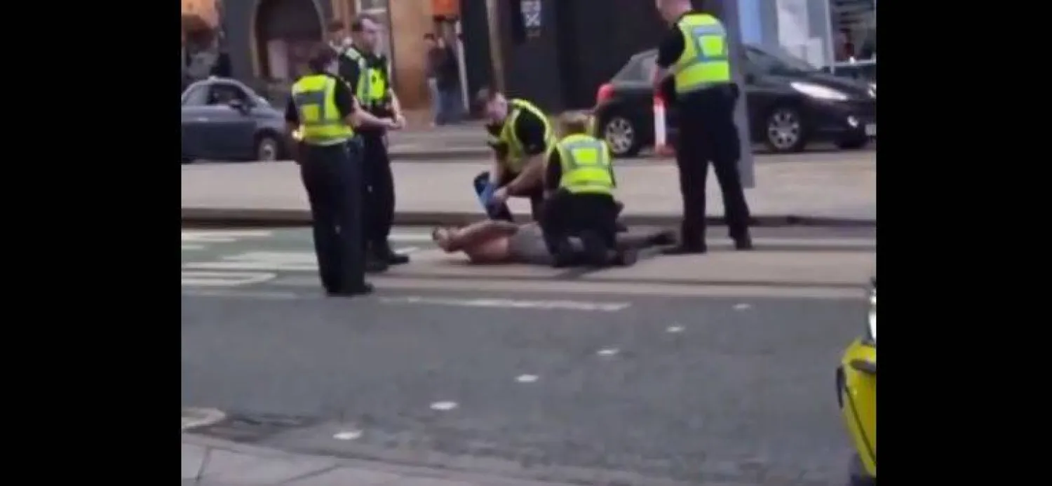 A still from a video showing British police officers arresting the suspect in Edinburgh.