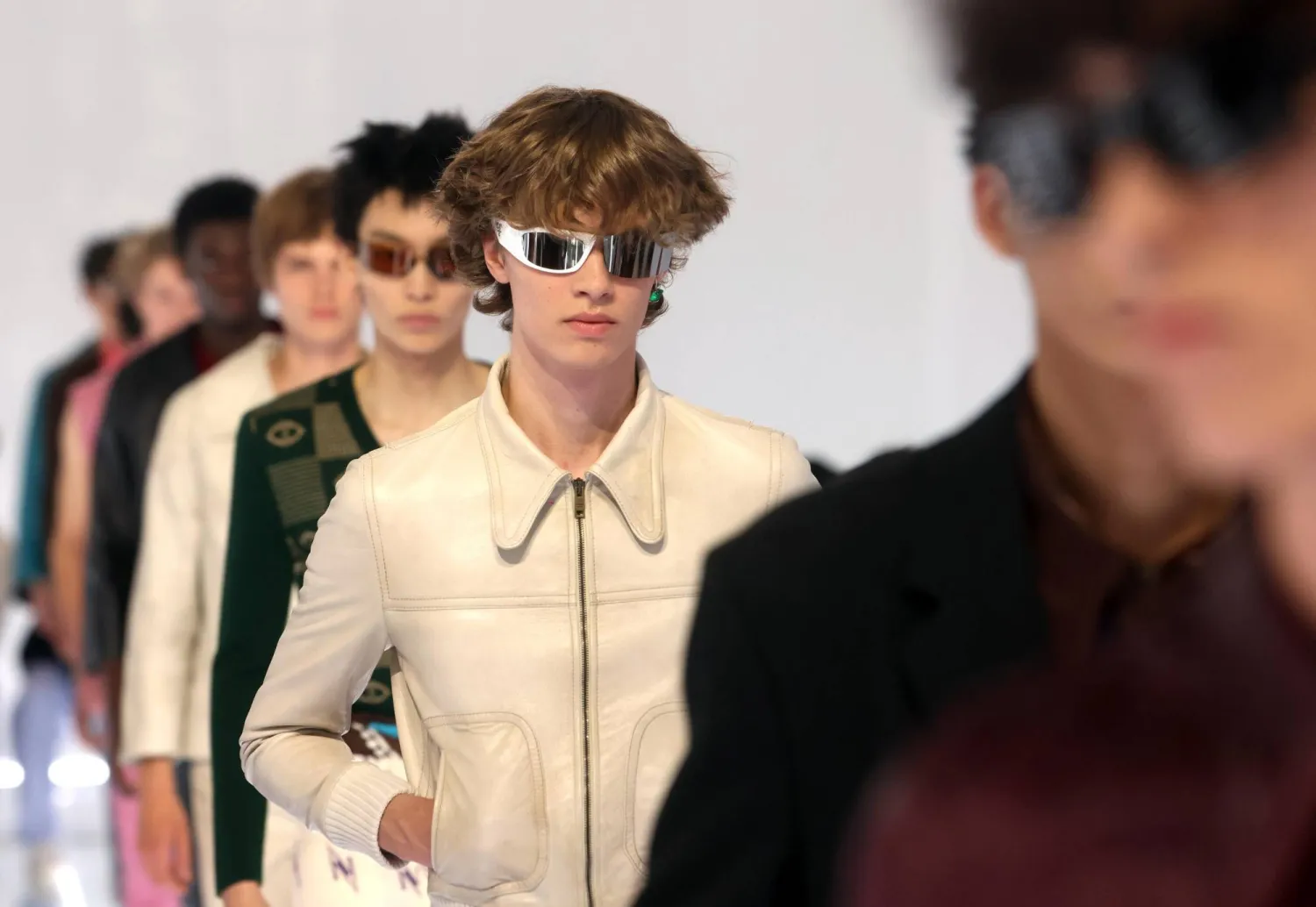 Models present creations by Italian fashion house Prada for the Men's Spring/Summer 2027 collection during the Milan Fashion Week in Milan, Italy, 21 June 2026. Milan Fashion Week runs from 19 to 23 June 2026. (EPA)