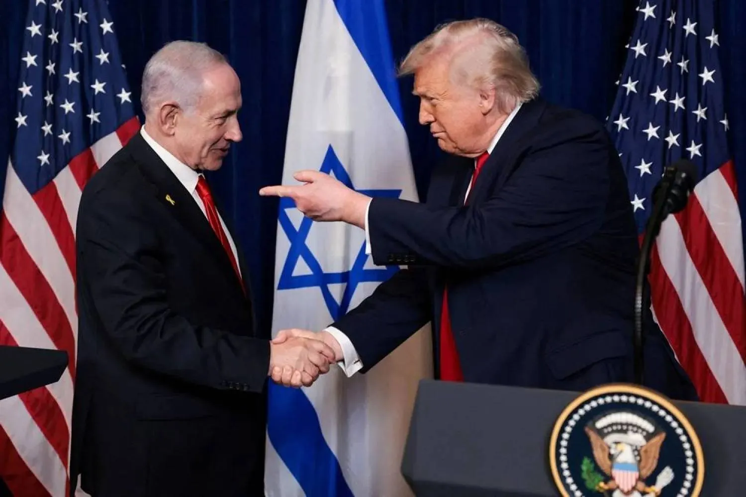 US President Donald Trump points his finger towards Israeli Prime Minister Benjamin Netanyahu as they shake hands during a press conference after meeting at Trump’s Mar-a-Lago club in Palm Beach, Florida, US, December 29, 2025. (Reuters)