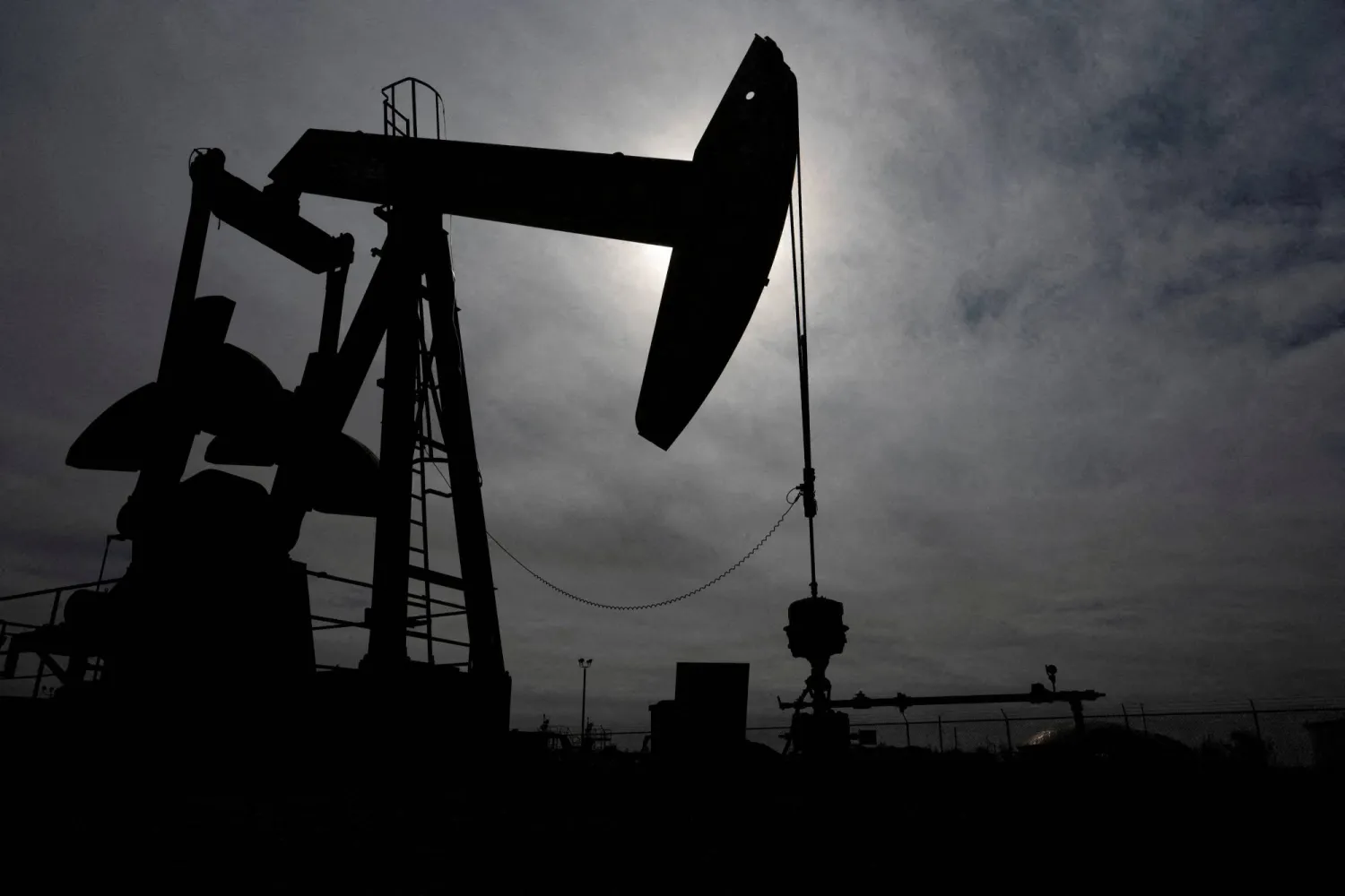 A pump jack operates near a crude oil reserve in the Permian Basin oil field near Midland, Texas, US February 18, 2025. REUTERS/Eli Hartman/File Photo 