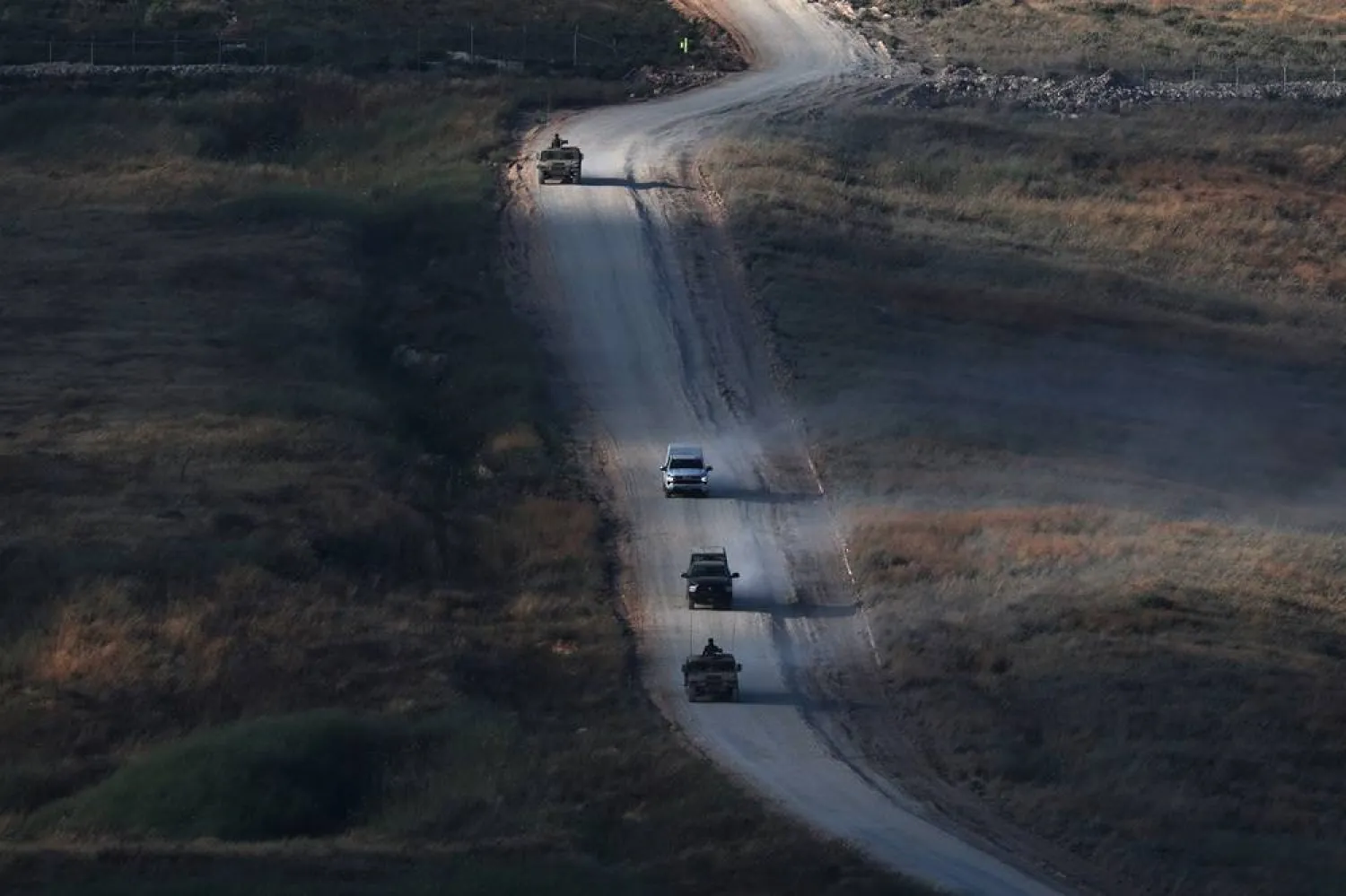 Israeli military vehicles maneuver on the Lebanese side of the Israel-Lebanon border, as seen from the Upper Galilee, in northern Israel, 21 June 2026. (EPA)