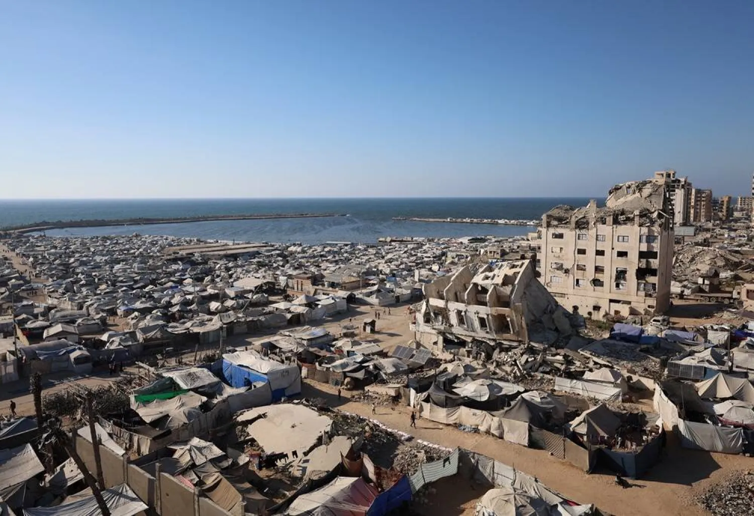  Tents housing displaced Palestinians stand amid summer heat in Gaza City, June 20, 2026. (Reuters)