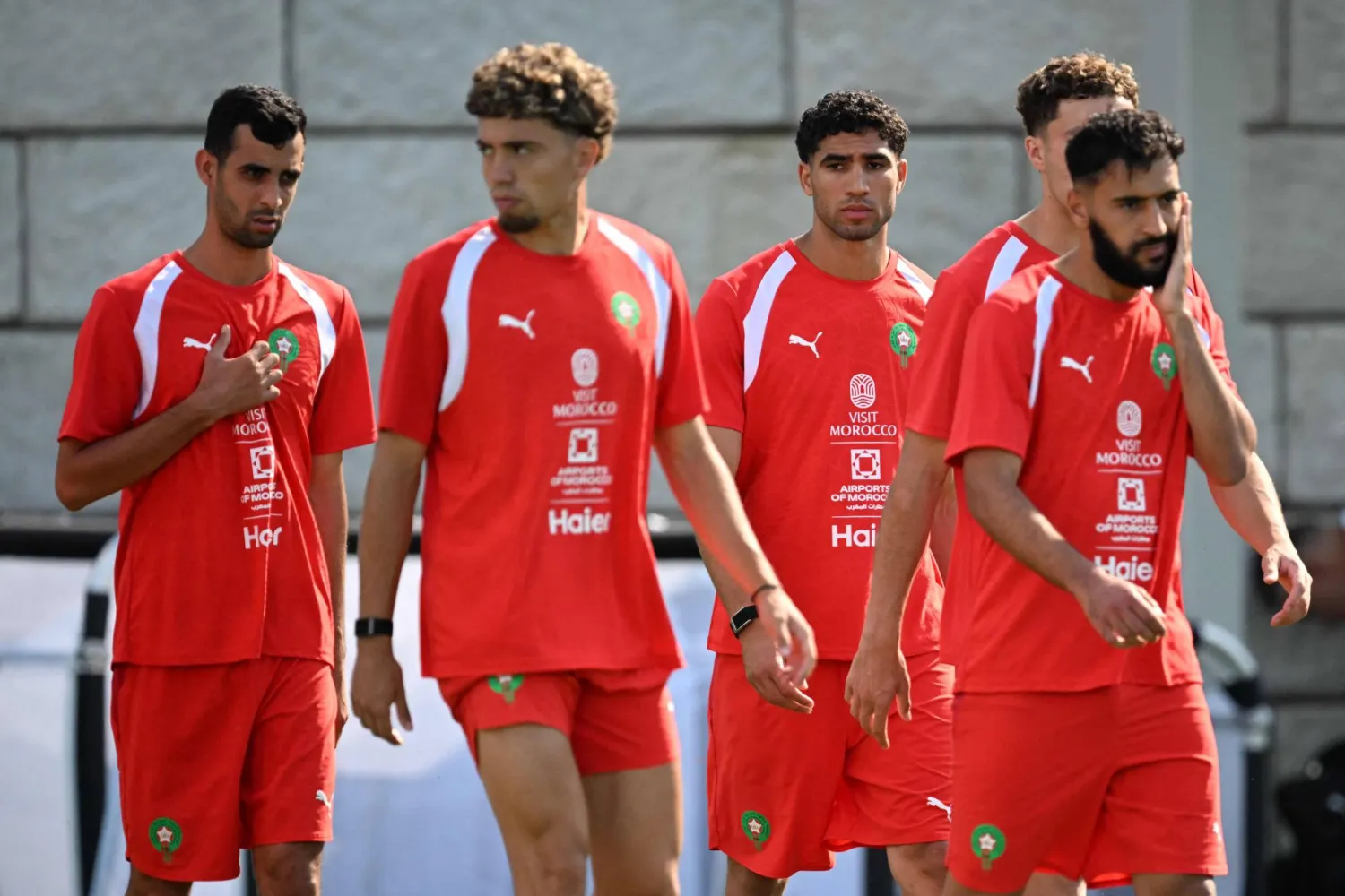  (From L) Morocco's defender #19 Youssef Belammari, midfielder #24 Neil El Aynaoui and defender #02 Achraf Hakimi take part in a training session at The Pingry School in Basking Ridge, New Jersey on June 21, 2026, during the 2026 World Cup football tournament. (AFP) 