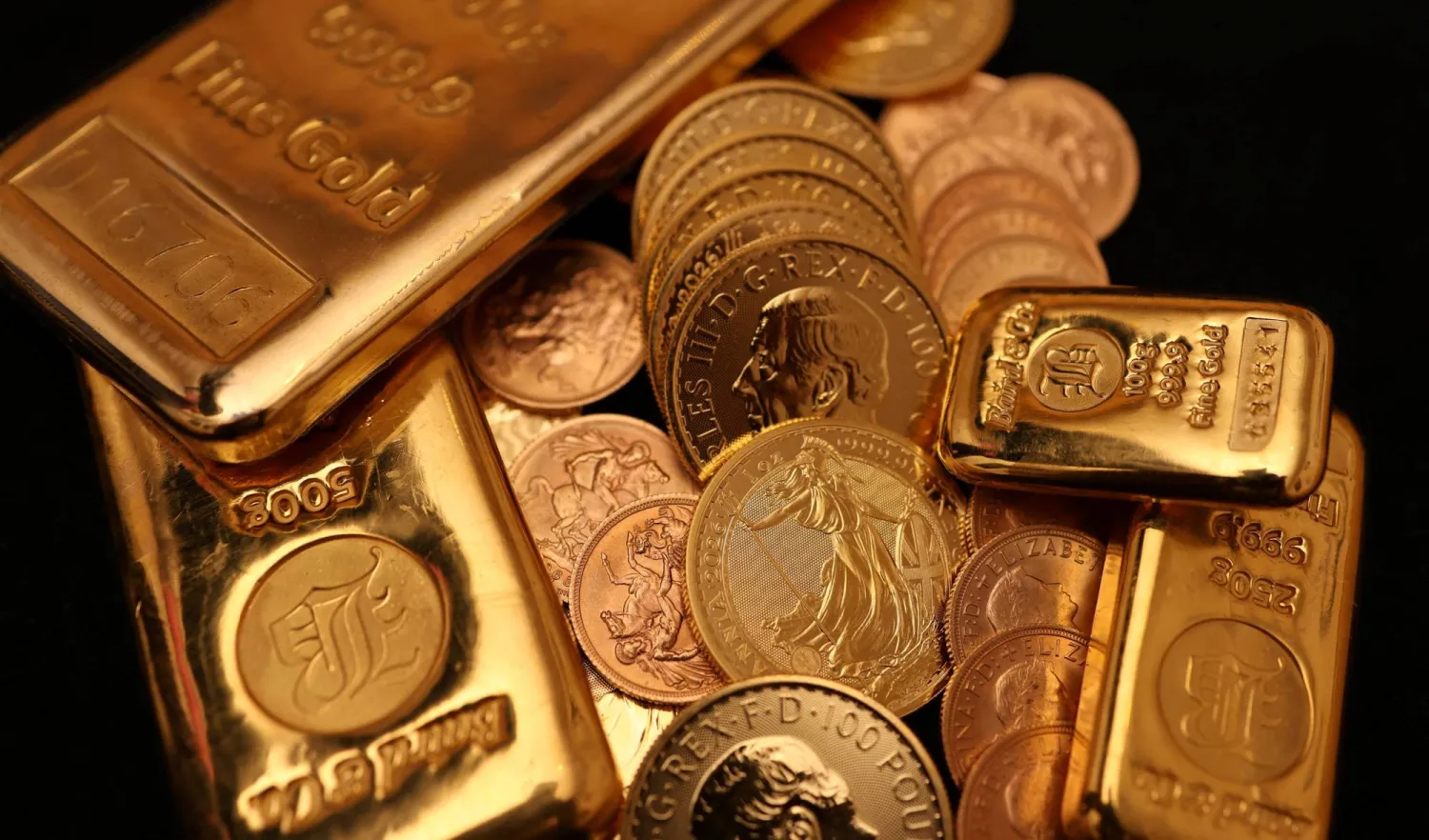British gold bars and sovereign coins on display in a London shop. (Reuters)