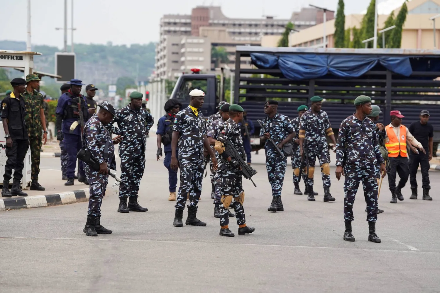 Security personnel stand guard near Eagle Square during a Democracy Day protest in Abuja, Nigeria, June 12, 2026. REUTERS/ Marvellous Durowaiye