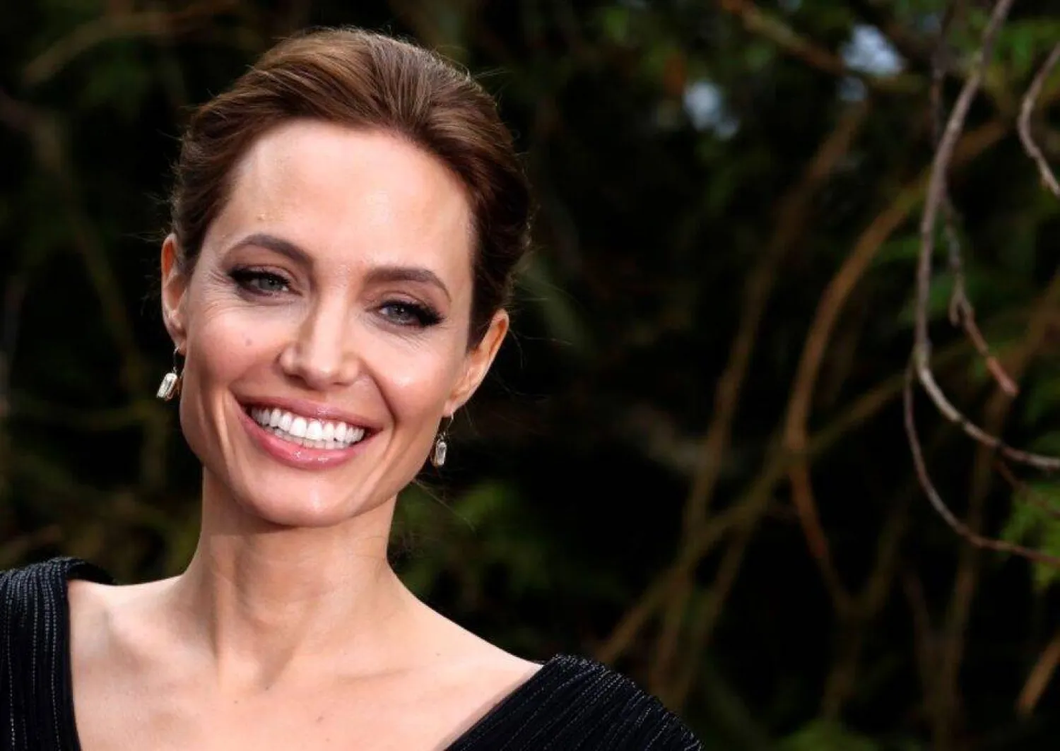 Actress Angelina Jolie arrives for a special Maleficent Costume Display at Kensington Palace in London in ths file photo taken May 8, 2014. REUTERS/Luke MacGregor/Files
