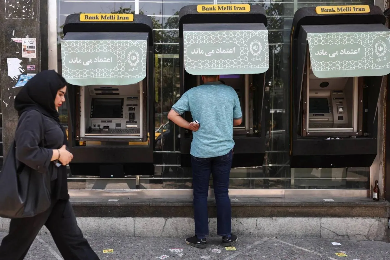 A man uses an ATM of Bank Melli Iran in front of a bank in Tehran, Iran, June 17, 2026. Majid Asgaripour/WANA (West Asia News Agency) via REUTERS