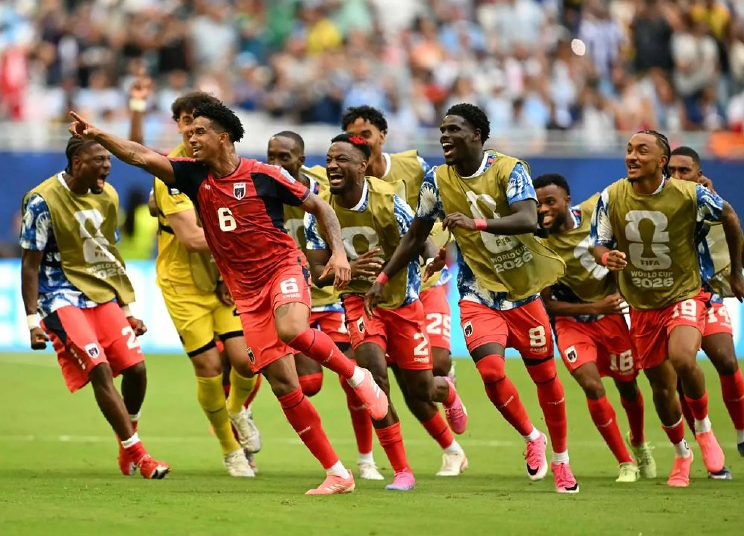 Cape Verde's midfielder #06 Kevin Pina celebrates with teammates after scoring his team's first goal during the 2026 World Cup Group H football match between Uruguay and Cape Verde at the Miami Stadium in Miami Gardens on June 21, 2026. (AFP)