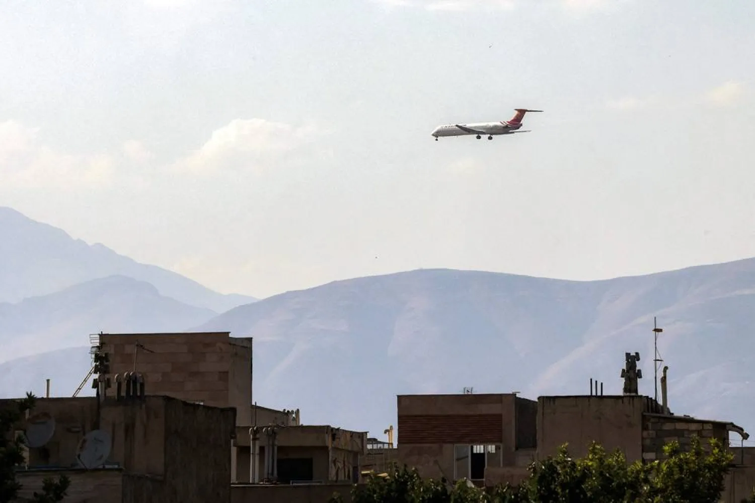  A Kish Air Airlines McDonnell Douglas MD-82 passenger aircraft prepares for landing at Tehran's Mehrabad Airport on June 20, 2026. (AFP) 