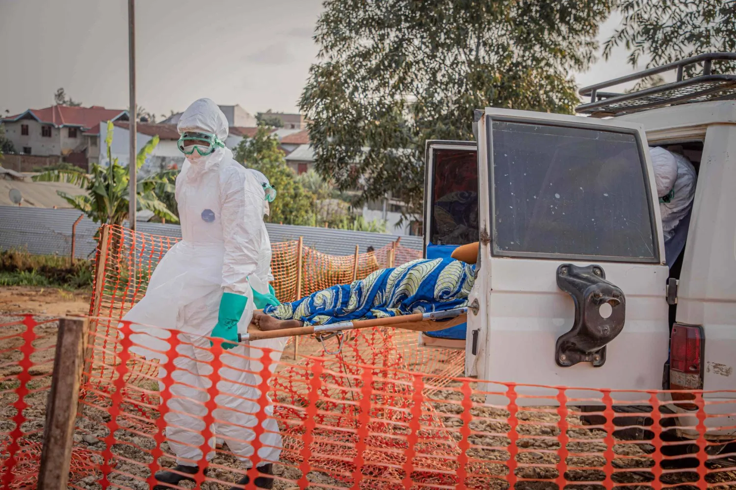 Healthcare workers carry on a stretcher a patient suffering from the Ebola virus disease from an ambulance at the Ebola Treatment Center (ETC) in Bunia, Ituri, in the east of the Democratic Republic of Congo on June 23, 2026. (Photo by Benediction MURHABAZI / AFP)