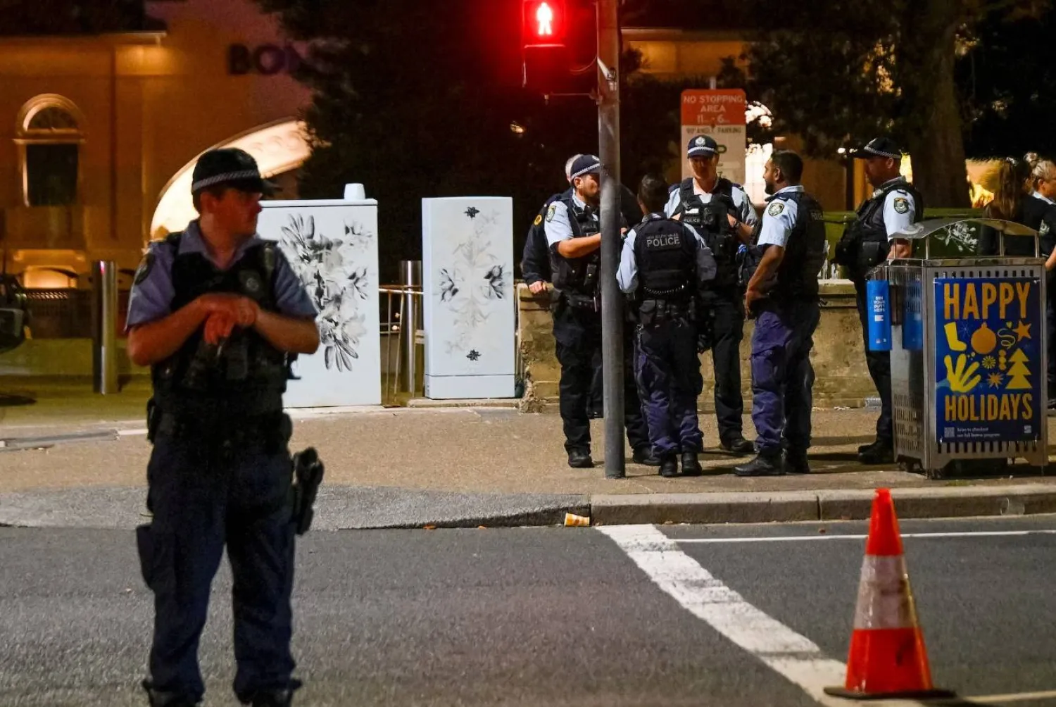 Police officers gather at the scene of a shooting incident at Bondi Beach, Sydney, Australia, December 14, 2025. (Reuters)