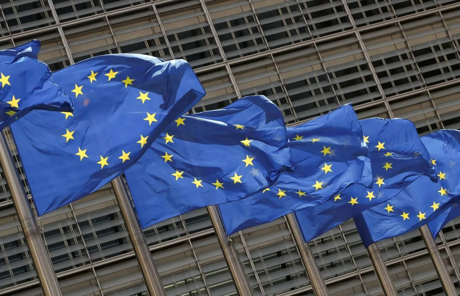 European Union flags flutter outside the EU Commission headquarters in Brussels, Belgium May 5, 2021. REUTERS/Yves Herman/File Photo
