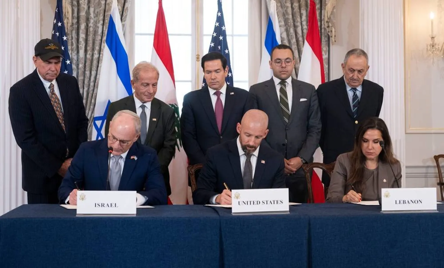 US Secretary of State Marco Rubio and others watch, seated from left, Israel's Ambassador to the US Yechiel Leiter, counselor Dan Holler, and Lebanon's Ambassador to the US Nada Hamadeh, sign a framework agreement, described as a first step toward peace following months of conflict between Israel and the Lebanese group Hezbollah, at the State Department, Friday, June 26, 2026, in Washington. (AP) 