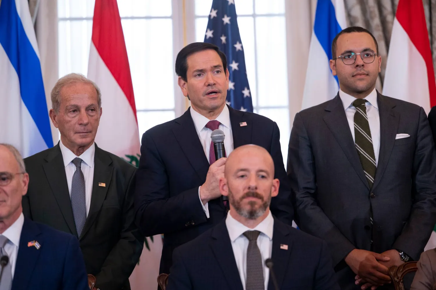 US Secretary of State Marco Rubio, top center, speaks at the start of a signing of a framework agreement, described as a first step toward peace following months of conflict between Israel and the Lebanese group Hezbollah, at the State Department, Friday, June 26, 2026, in Washington. (AP) 