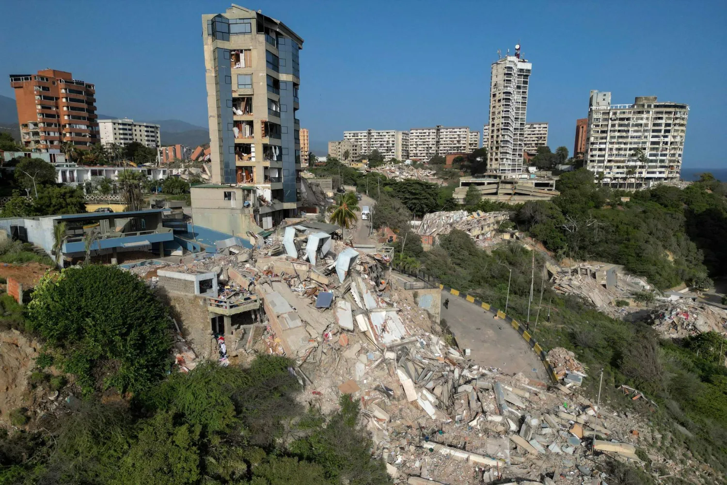 This aerial view shows collapsed buildings in Catia La Mar, La Guaira state, Venezuela, on June 27, 2026, following earthquakes that struck the region. (AFP)