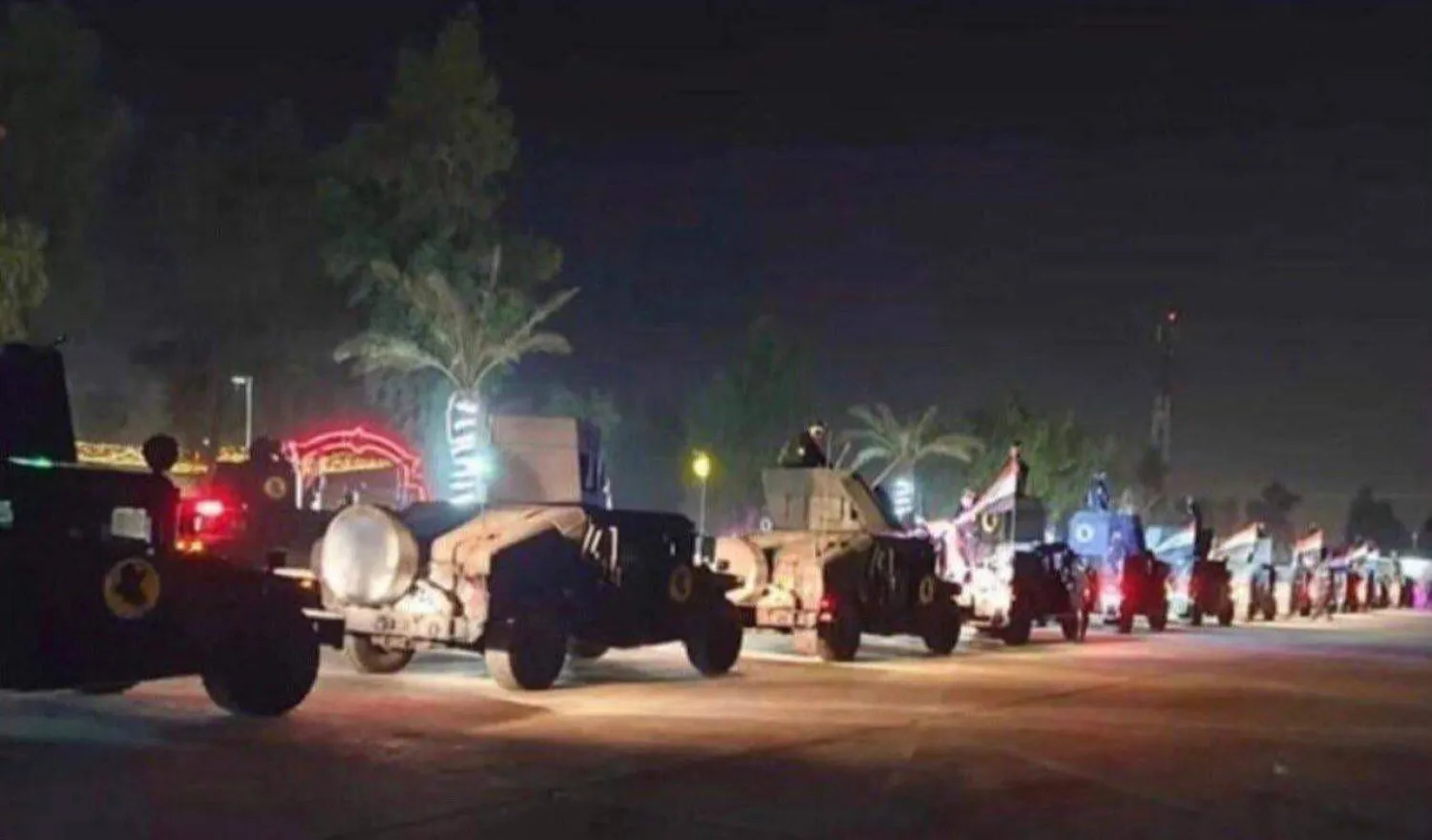 A circulating image shows Iraqi Humvees at an entrance to the Green Zone at dawn Sunday