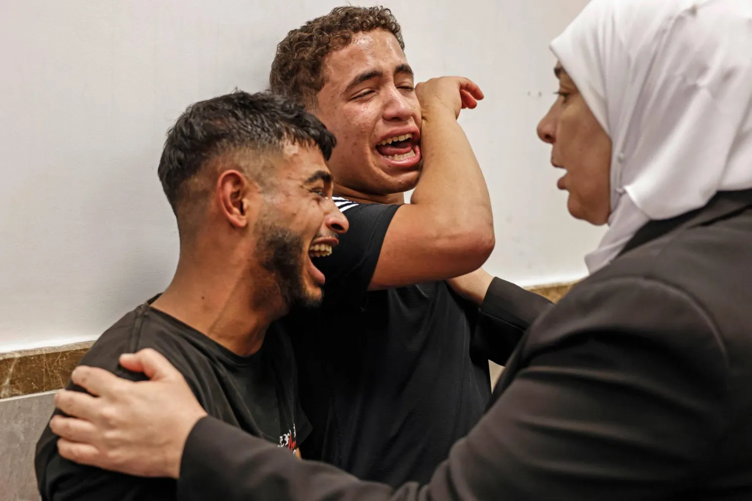 Relatives mourn the death of Amir Ahmad Jawad Jaber, a Palestinian teenager who was killed during an Israeli raid, at a hospital in Ramallah, in the Israeli-occupied West Bank on June 29, 2026. (AFP)