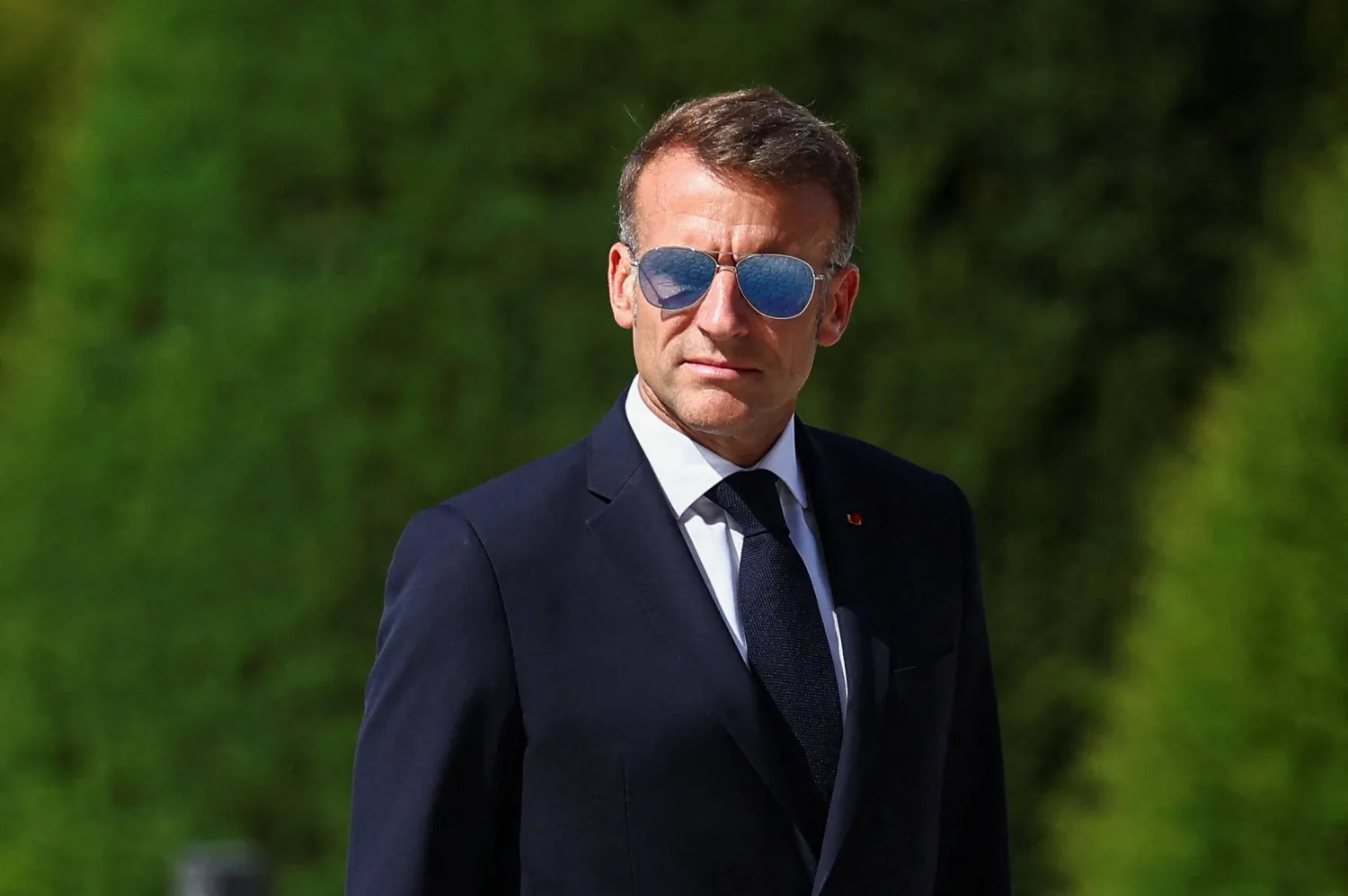 France's President Emmanuel Macron looks on during a welcoming ceremony for Thailand's King Maha Vajiralongkorn and Queen Suthida (not pictured) in the courtyard of the Hotel des Invalides in Paris on June 29, 2026, as part of an official state visit of the Thai King to France. (AFP)