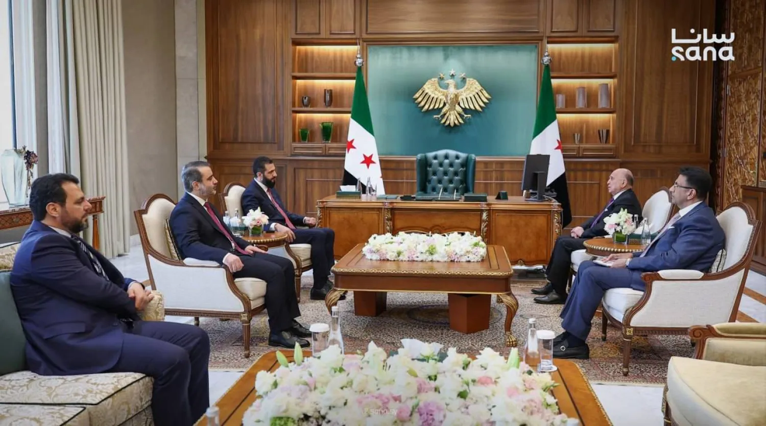 Syrian President Ahmed al-Sharaa receives Iraqi FM Fuad Hussein in Damascus on Monday. (SANA)