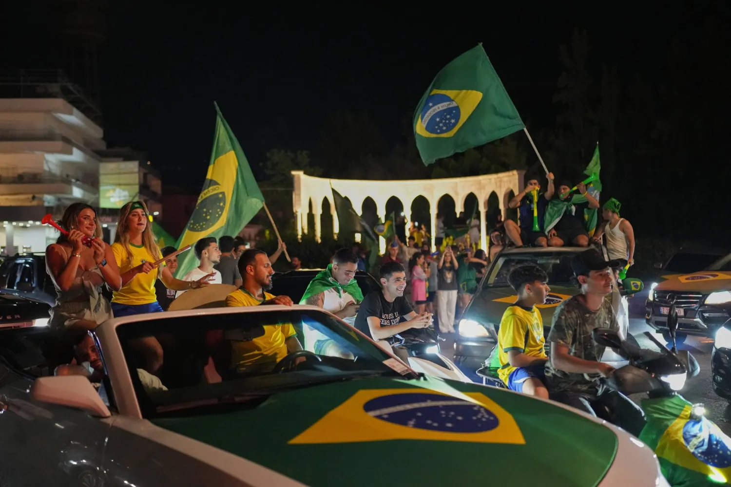 Supporters of Brazil's national team celebrate, after Brazil defeated Japan in a Round of 32 soccer match at the FIFA World Cup, in Zgharta, northern Lebanon, Monday, June 29, 2026. (AP)