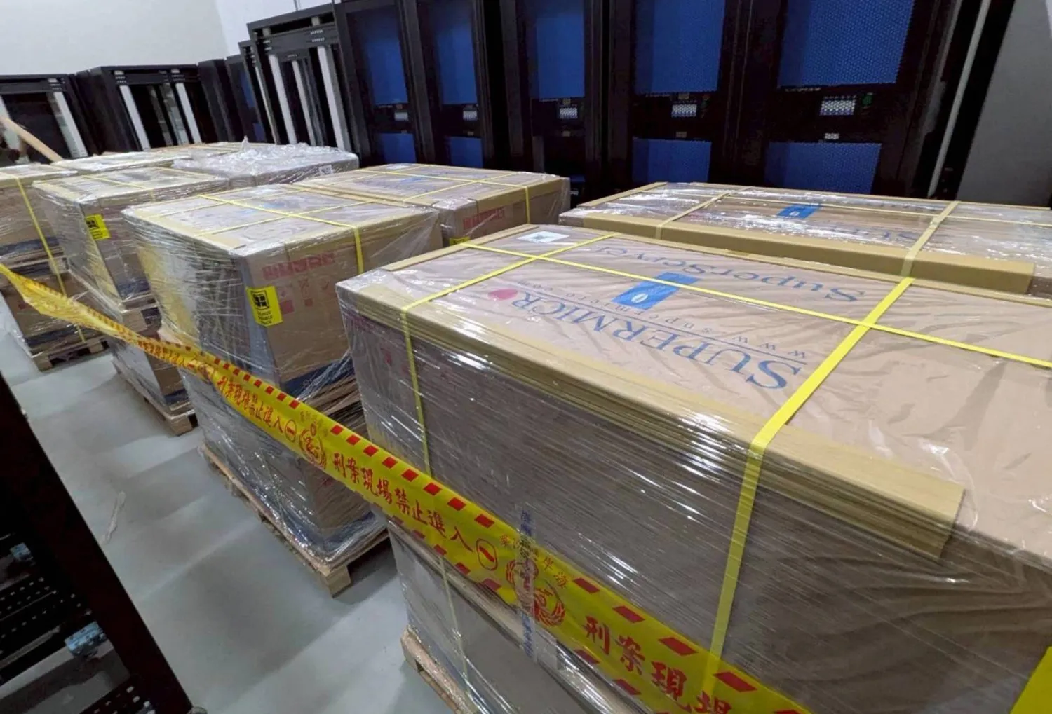 This handout photo from the Taiwan Coast Guard taken on May 20, 2026 and released on May 21 shows pallets of servers made by Super Micro Computer seized by Taiwanese authorities at an undisclosed location. (Photo by Handout / TAIWAN COAST GUARD / AFP) 