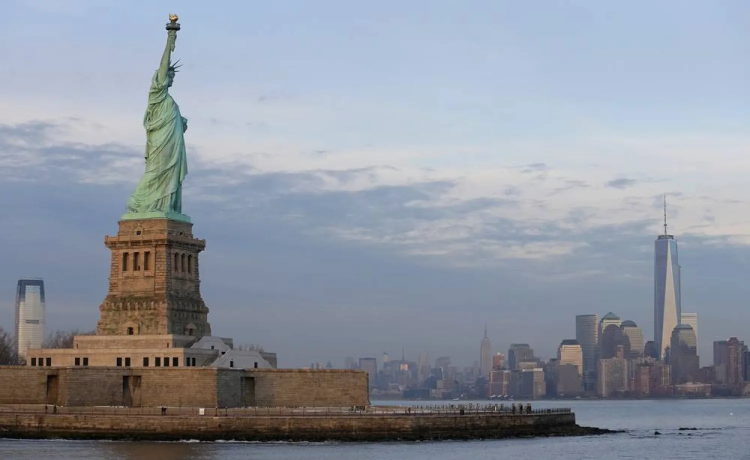 The lower Manhattan skyline, including the new One World Trade Center building at right, is shown as viewed from near the Statue of Liberty, Jan. 31, 2014, in New York.  (AP)