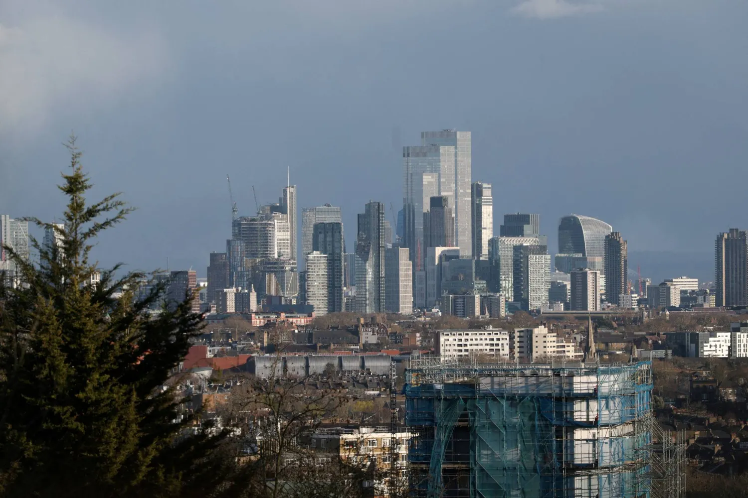 FILE PHOTO: The London skyline is seen with the financial district in the background, in London, Britain, March 25, 2026. REUTERS/Isabel Infantes/File Photo