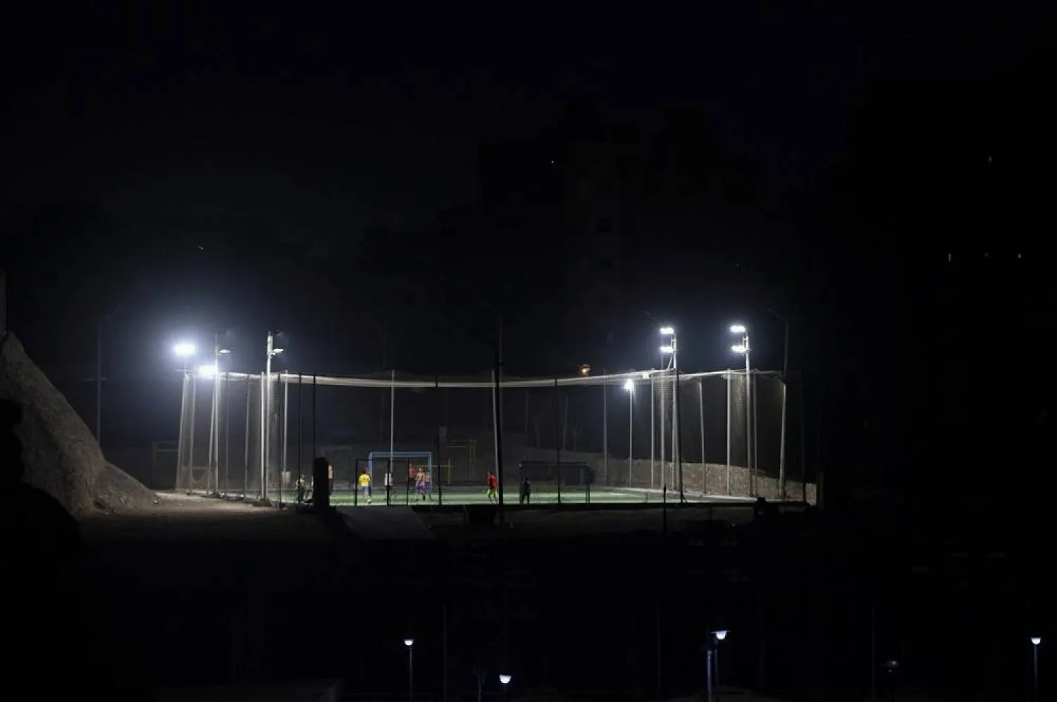  Egyptian youths play football in an open area beside a mountain near Cairo, Egypt, June 29, 2026, as the country follows the FIFA World Cup. (Reuters)