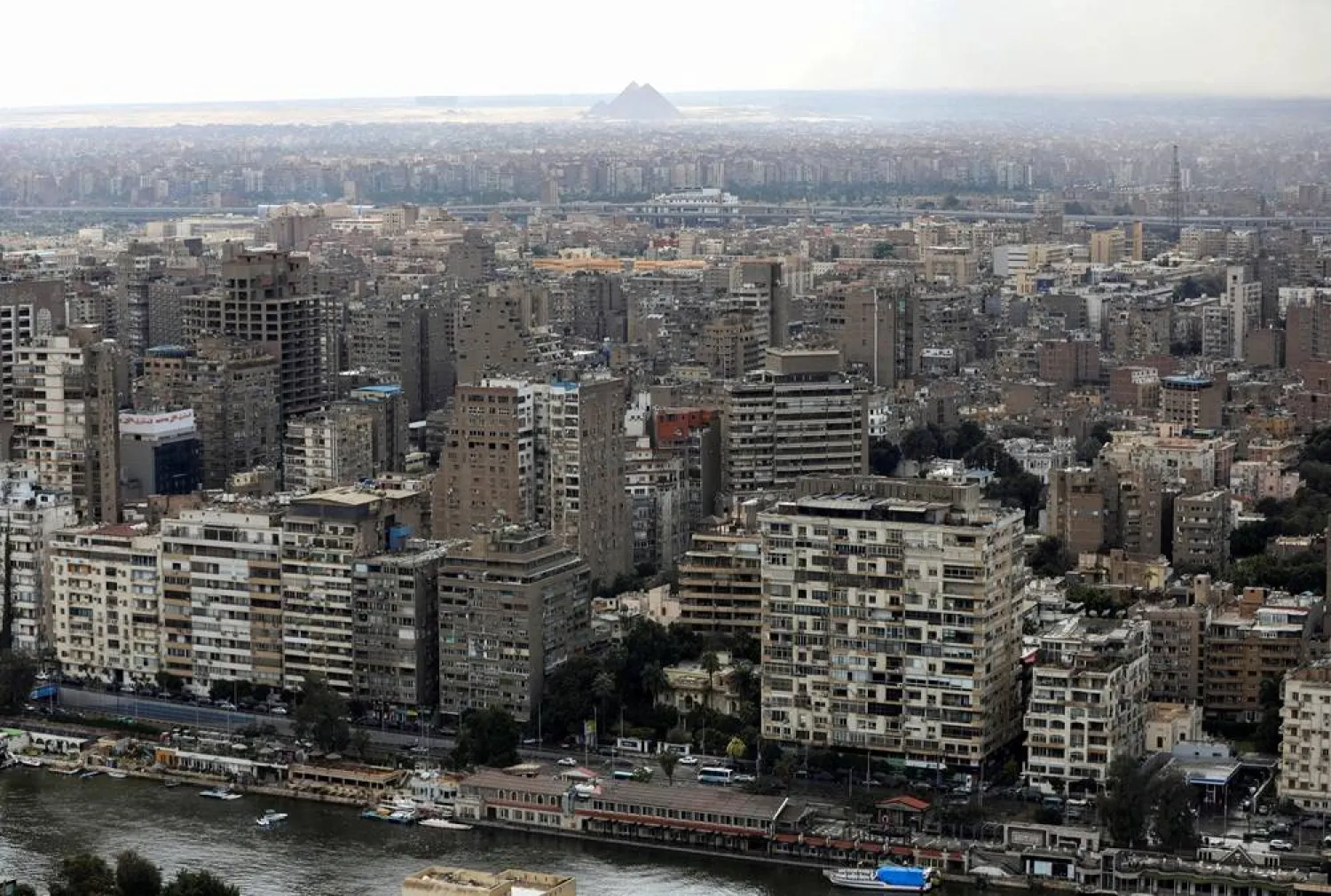 A general view of buildings and the Great Pyramids in Cairo, Egypt, March 25, 2026. (Reuters)