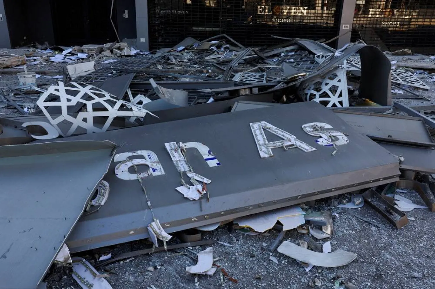 Debris lies at the site of a damaged branch of Al-Qard Al-Hassan, a financial institution linked to Lebanon's Hezbollah, in the aftermath of Israeli airstrikes that hit several branches of the institution, amid the ongoing hostilities between Hezbollah and Israeli forces, in Beirut suburbs, Lebanon, October 21, 2024. (Reuters)