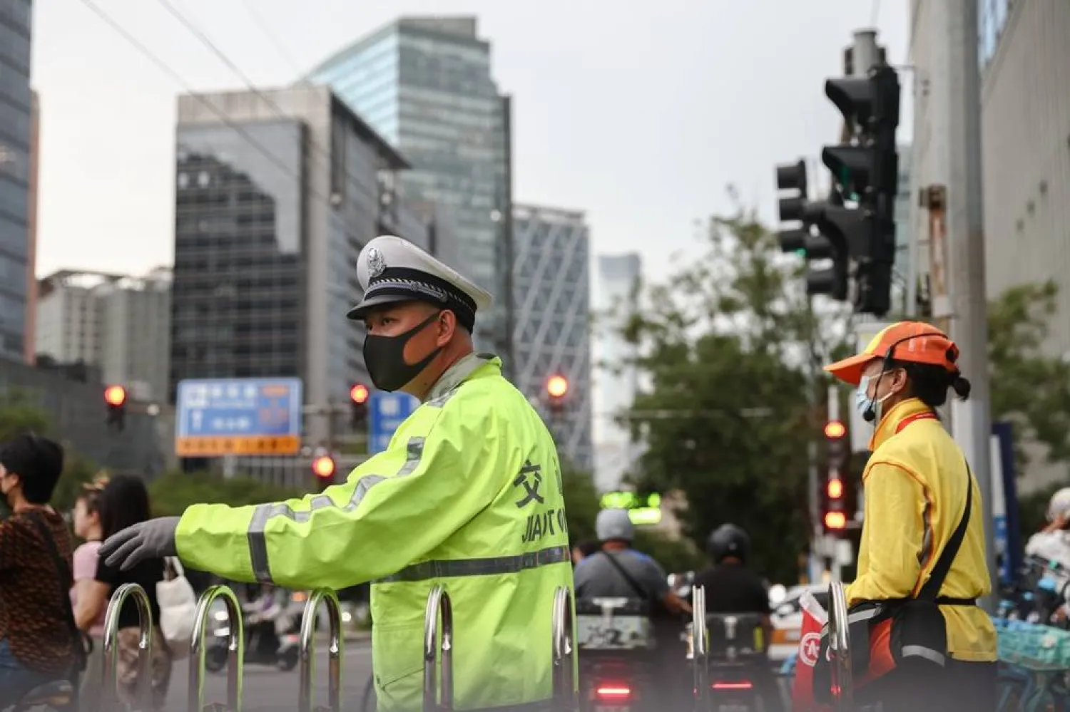 A traffic police stands guard on a street in Beijing's Central Business District (CBD) in Beijing, China, 22 June 2026. (EPA)