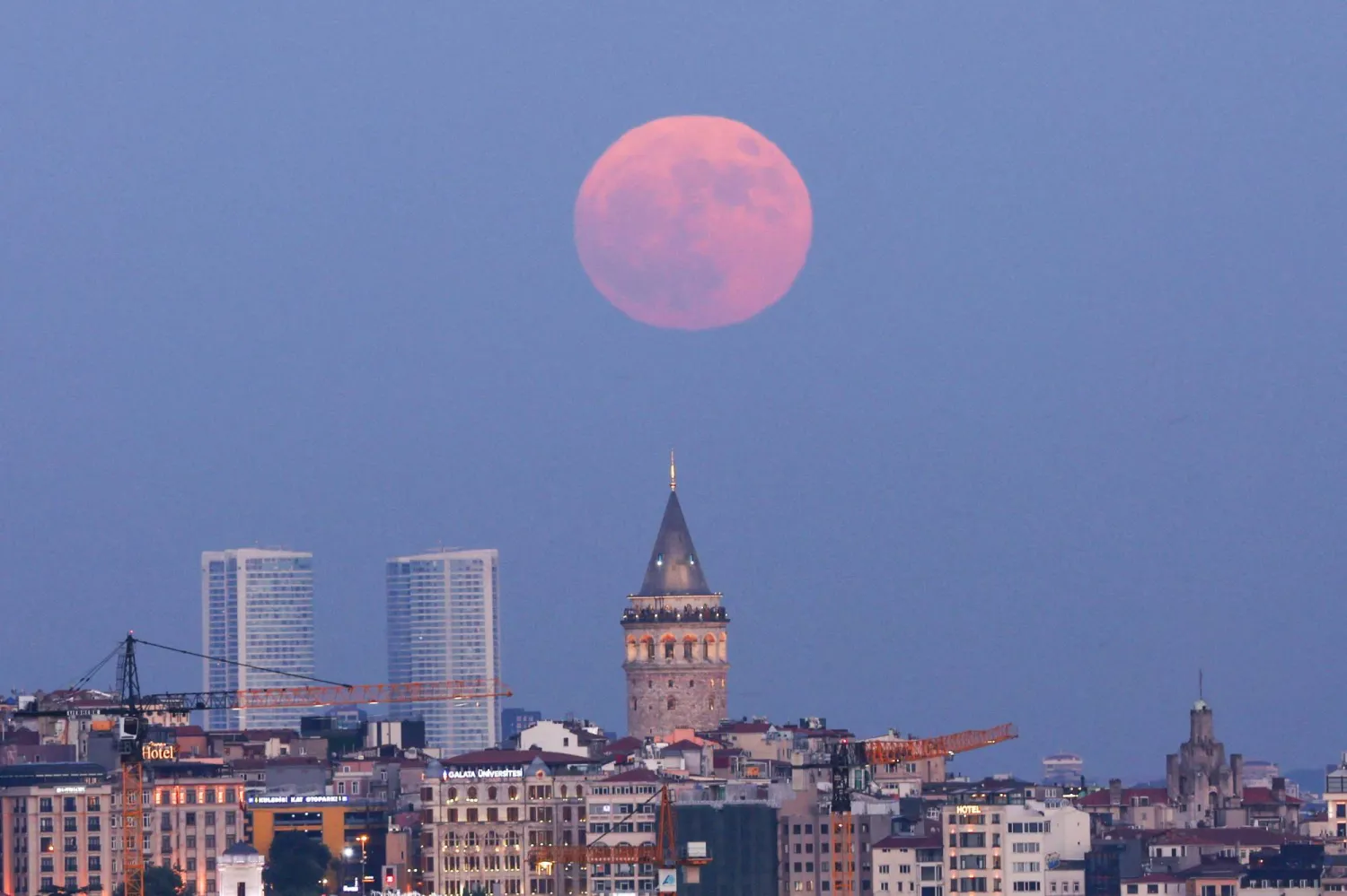  A full moon rises over the Galata Tower in Istanbul, Türkiye, June 29, 2026. (Reuters)