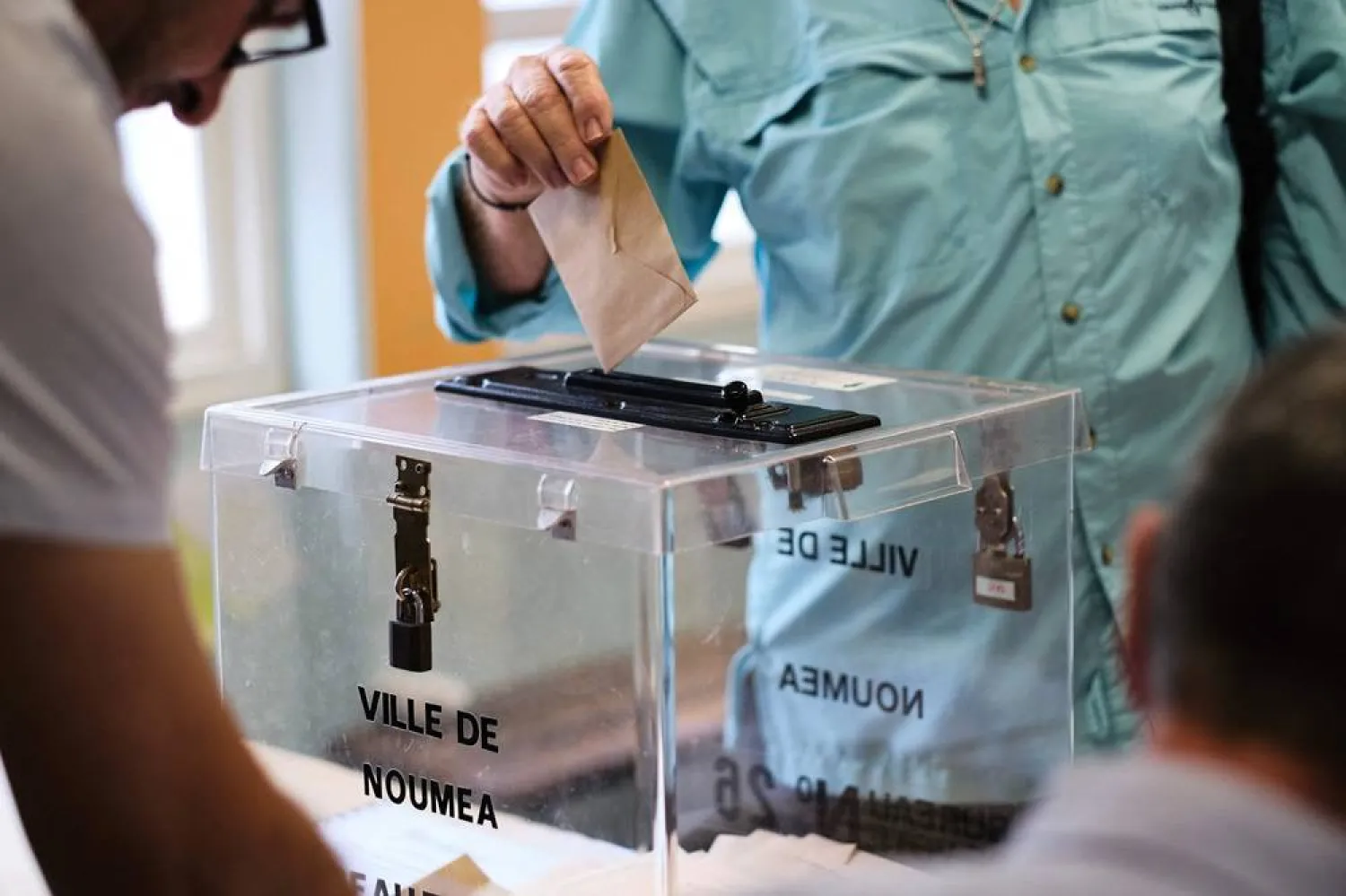 File photo: A person casts their vote at a polling station in the Magenta district during the first round of France's crunch legislative elections in Noumea in the first constituency of the French Pacific territory of New Caledonia, on June 30, 2024. (AFP)
