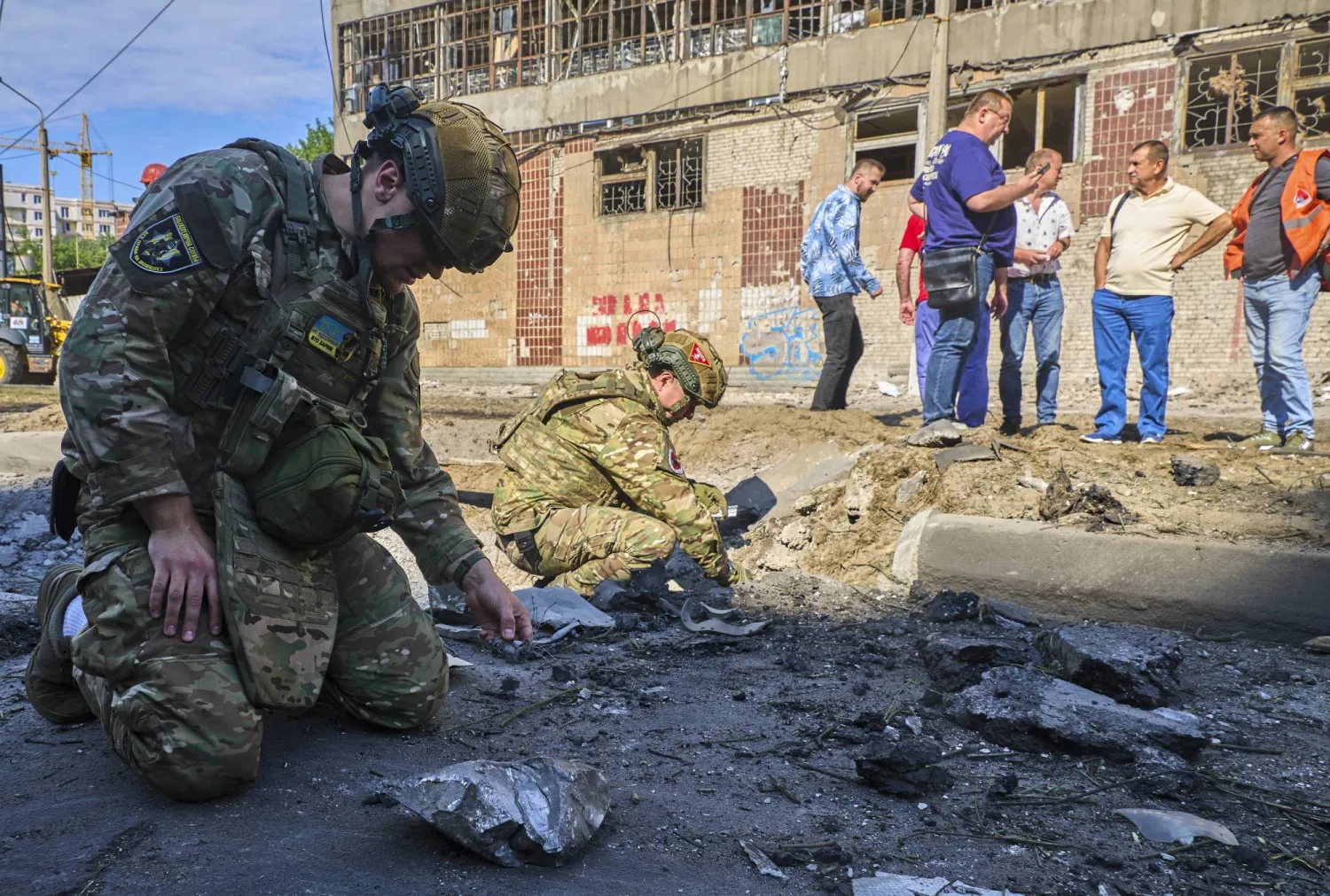 Ukrainian experts work at the site of a Russian glide bomb strike in Kharkiv, northeastern Ukraine, 29 June 2026, amid the Russian invasion. EPA/SERGEY KOZLOV
