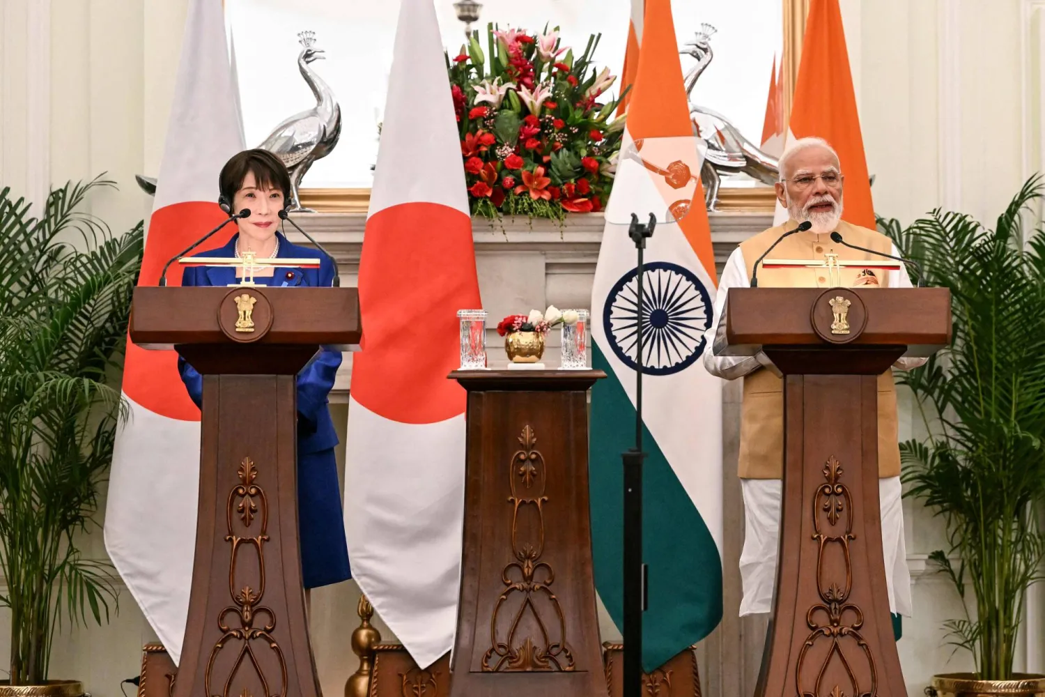 Japan's Prime Minister Sanae Takaichi (L) listens as India's Prime Minister Narendra Modi speaks during their joint press statements after their meeting at the Hyderabad House in New Delhi on July 2, 2026. (Photo by Sajjad HUSSAIN / AFP)