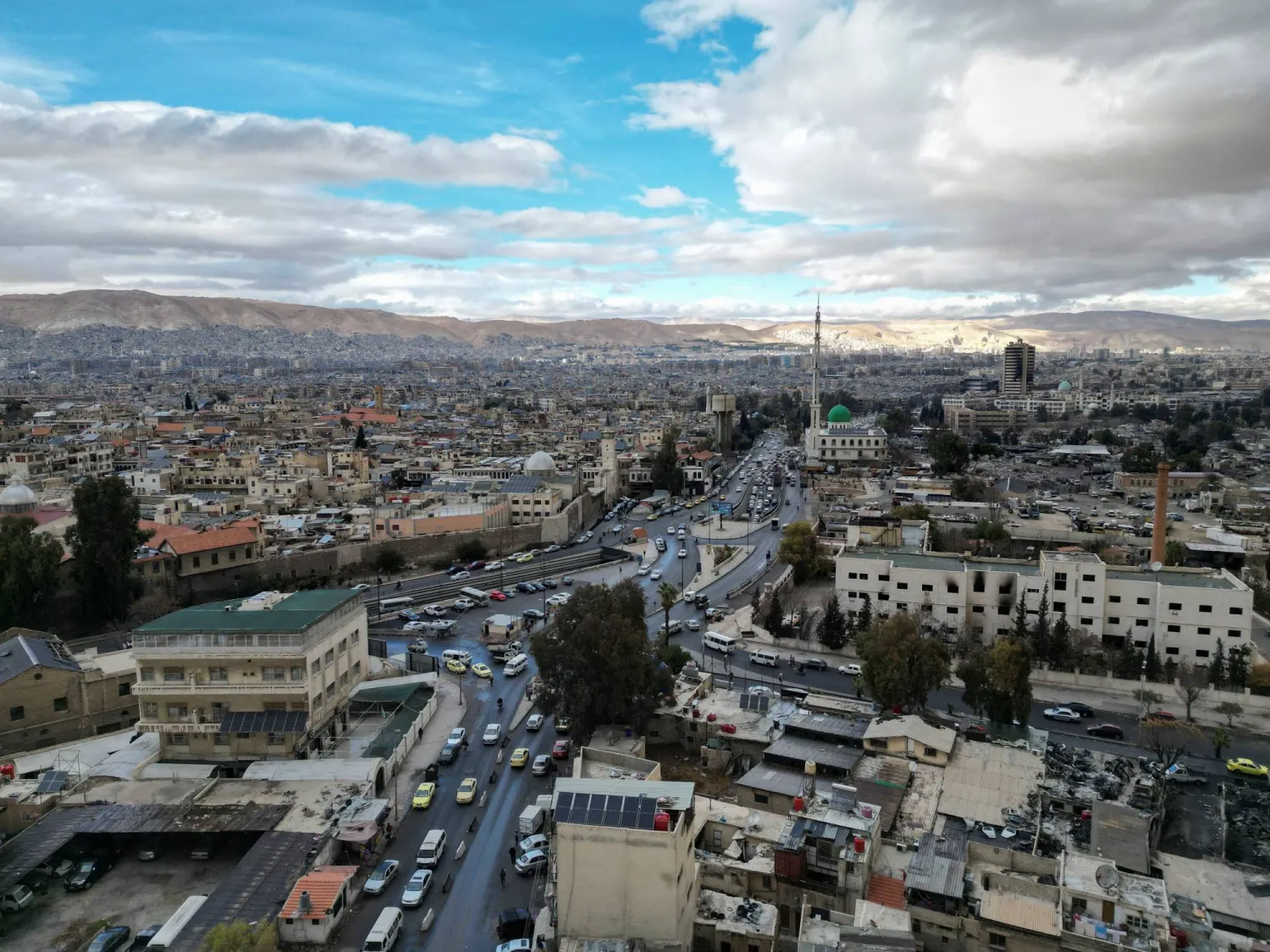 صورة التقطتها طائرة مسيّرة لمدينة دمشق في 22 ديسمبر 2024 (رويترز)