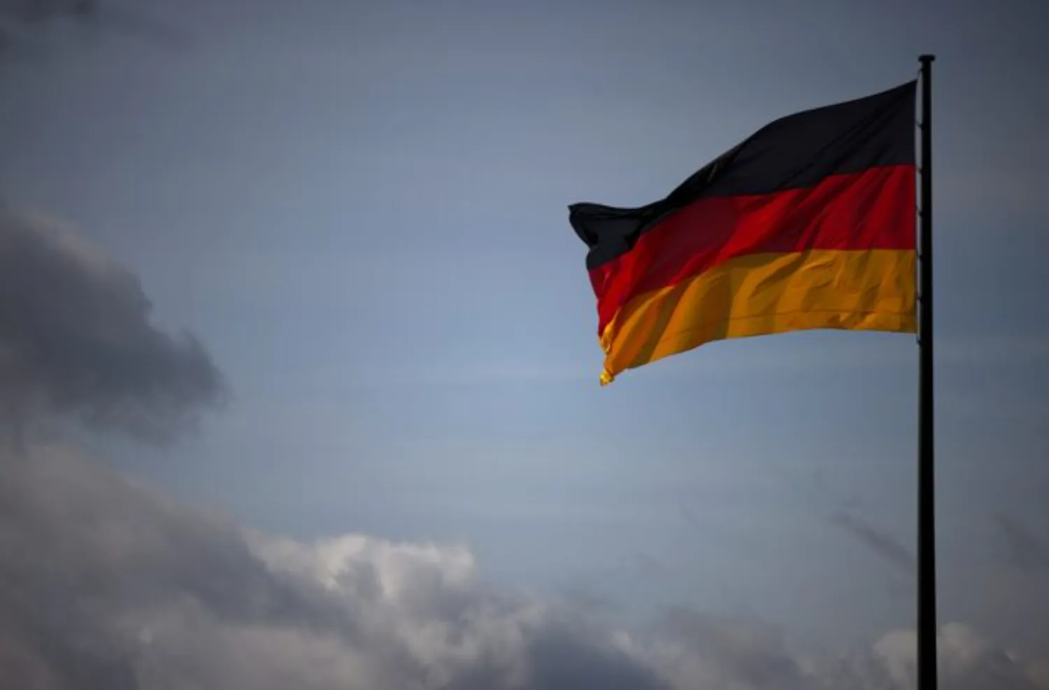 The German national flag flies in Berlin, Germany, April 5, 2022. REUTERS/Lisi Niesner 