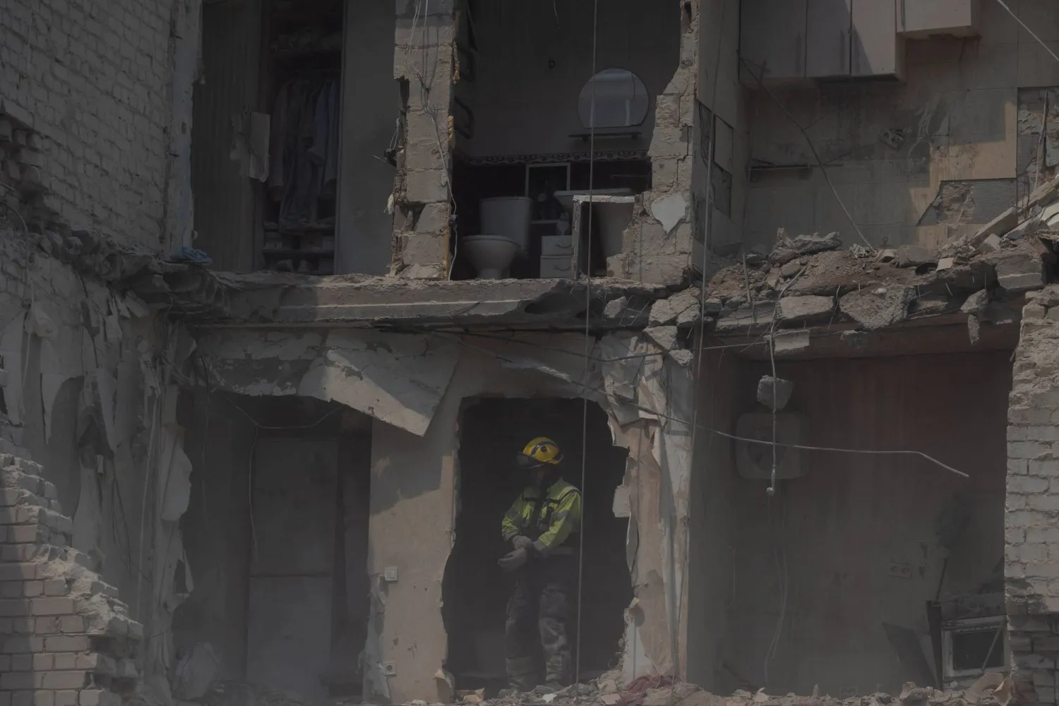A rescue worker stands in a residential building damaged following a Russian air attack on the Ukrainian capital of Kyiv on July 3, 2026, amid the Russian invasion in Ukraine. (AFP)