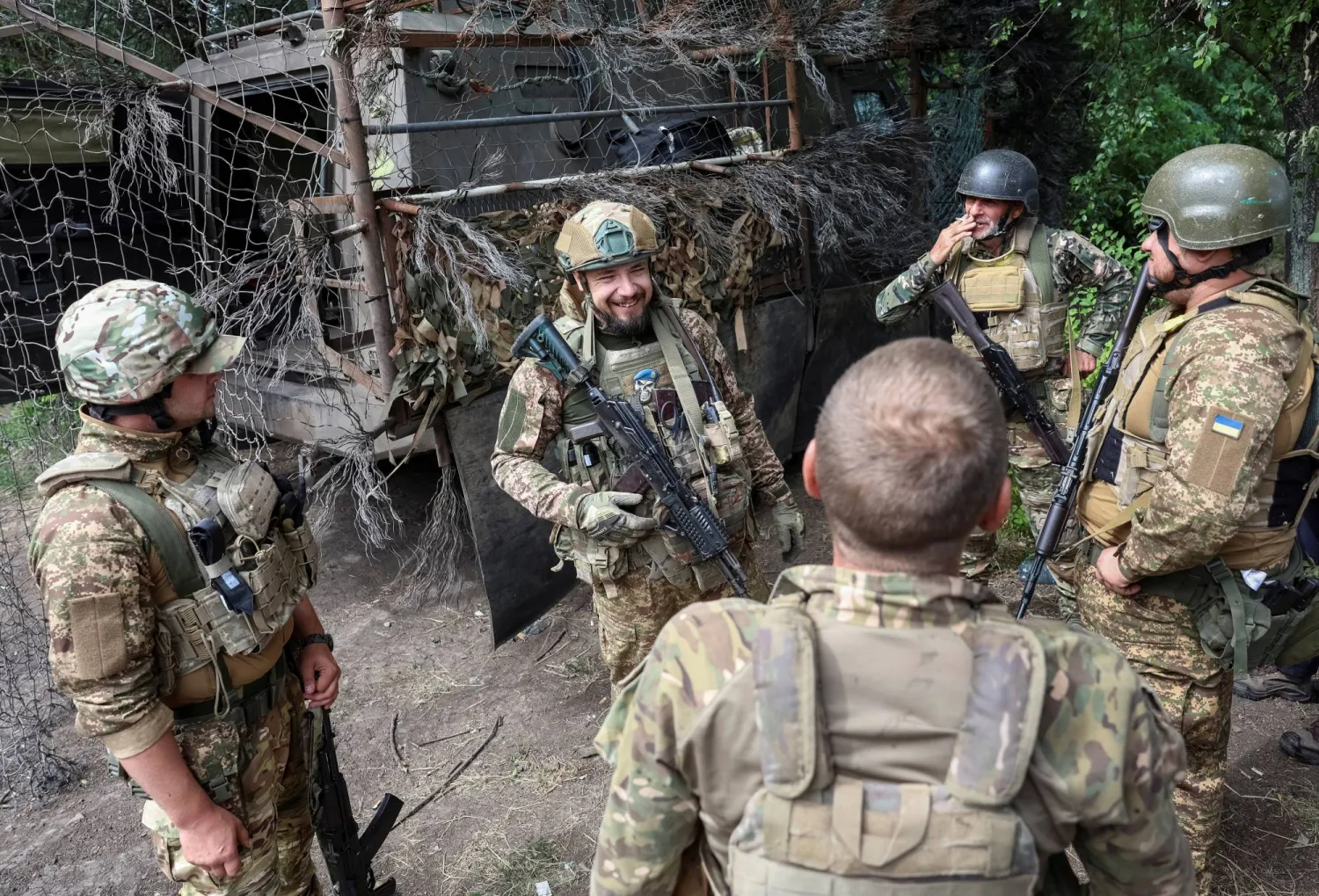 Servicemen of the 15th 'Kara-Dag' Brigade of the Operational Assignment of the National Guard of Ukraine chat before a combat mission, amid Russia's attack on Ukraine, near the frontline town of Dobropillia, in the Donetsk region, Ukraine June 28, 2026. REUTERS/Anatolii Stepanov