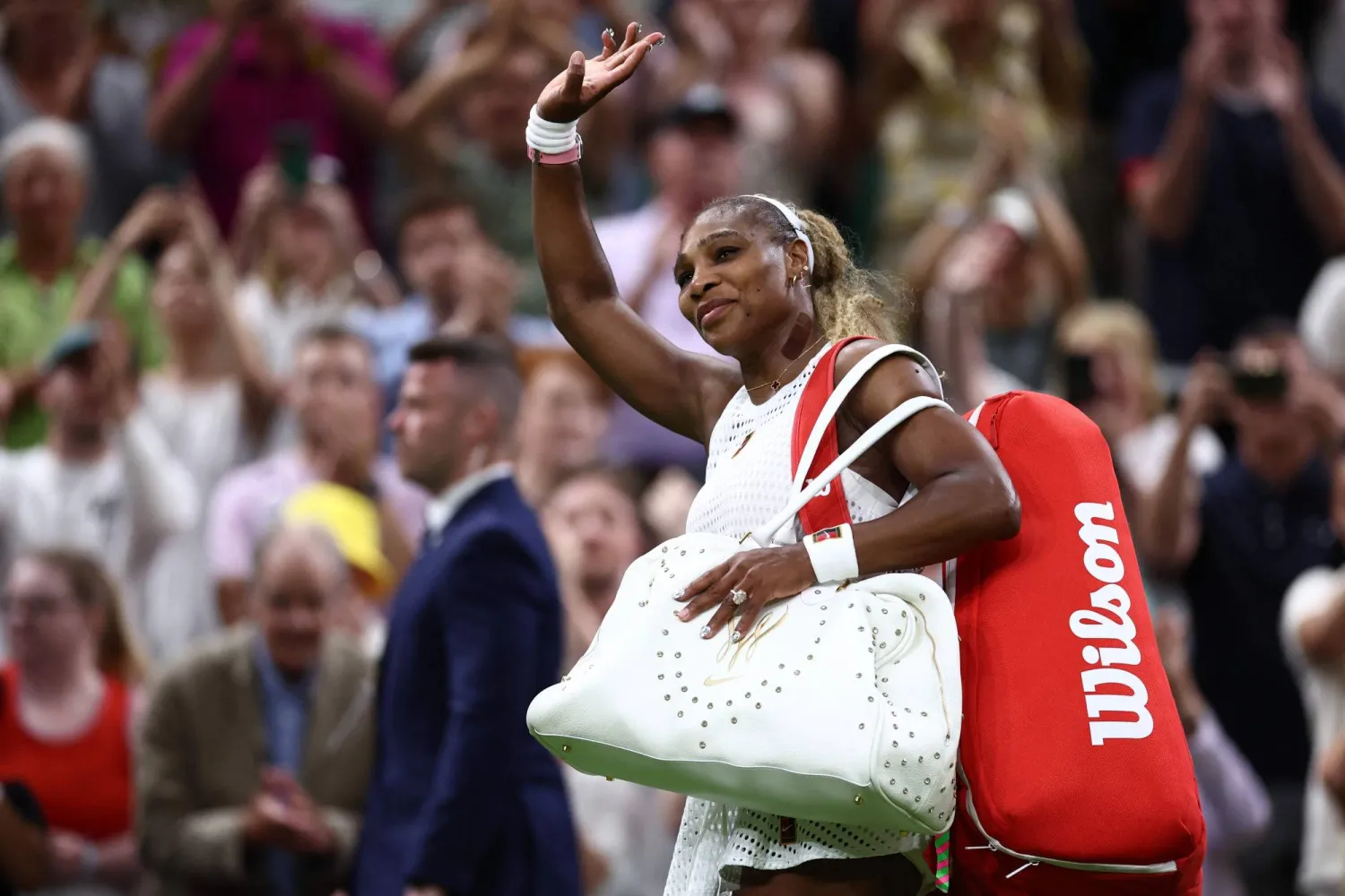 US player Serena Williams waves as he leaves the court after being defeated by Australia's Maya Joint during their women's singles first round tennis match on the second day of the 2026 Wimbledon Championships at The All England Lawn Tennis and Croquet Club in Wimbledon, southwest London, on June 30, 2026. (Photo by HENRY NICHOLLS / AFP) 