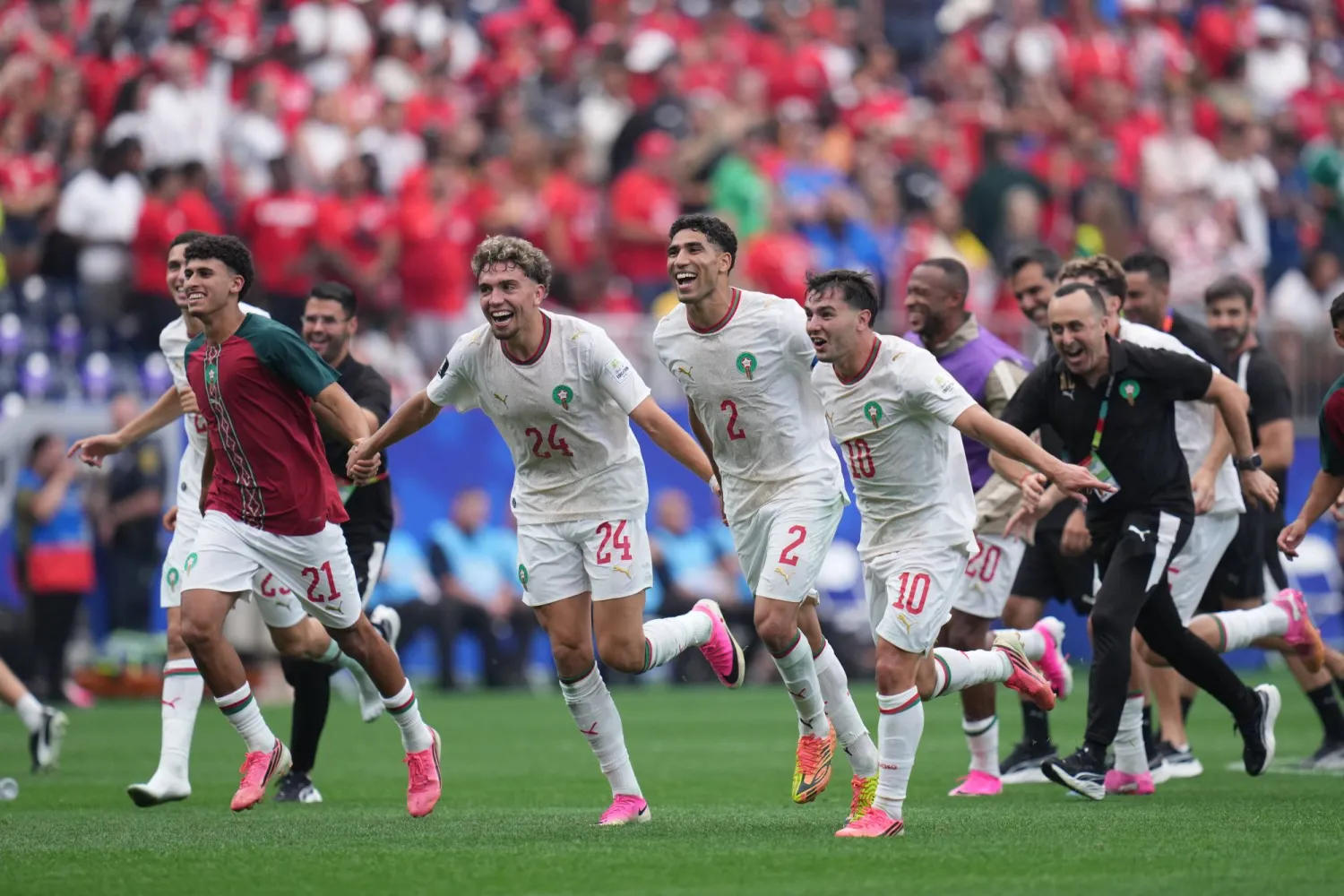 Morocco players celebrate their win over Canada after the World Cup round of 16 soccer match between Canada and Morocco, in Houston, Saturday, July 4, 2026. (AP Photo/Karen Warren)